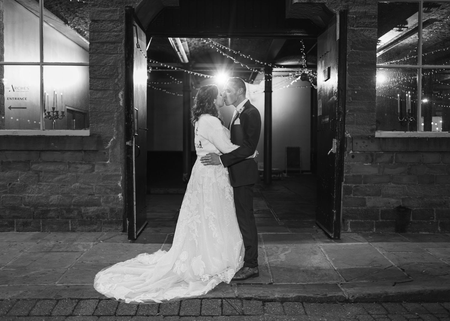 Black and white wedding photos showing couples dancing in an industrial venue space. Ephemera.