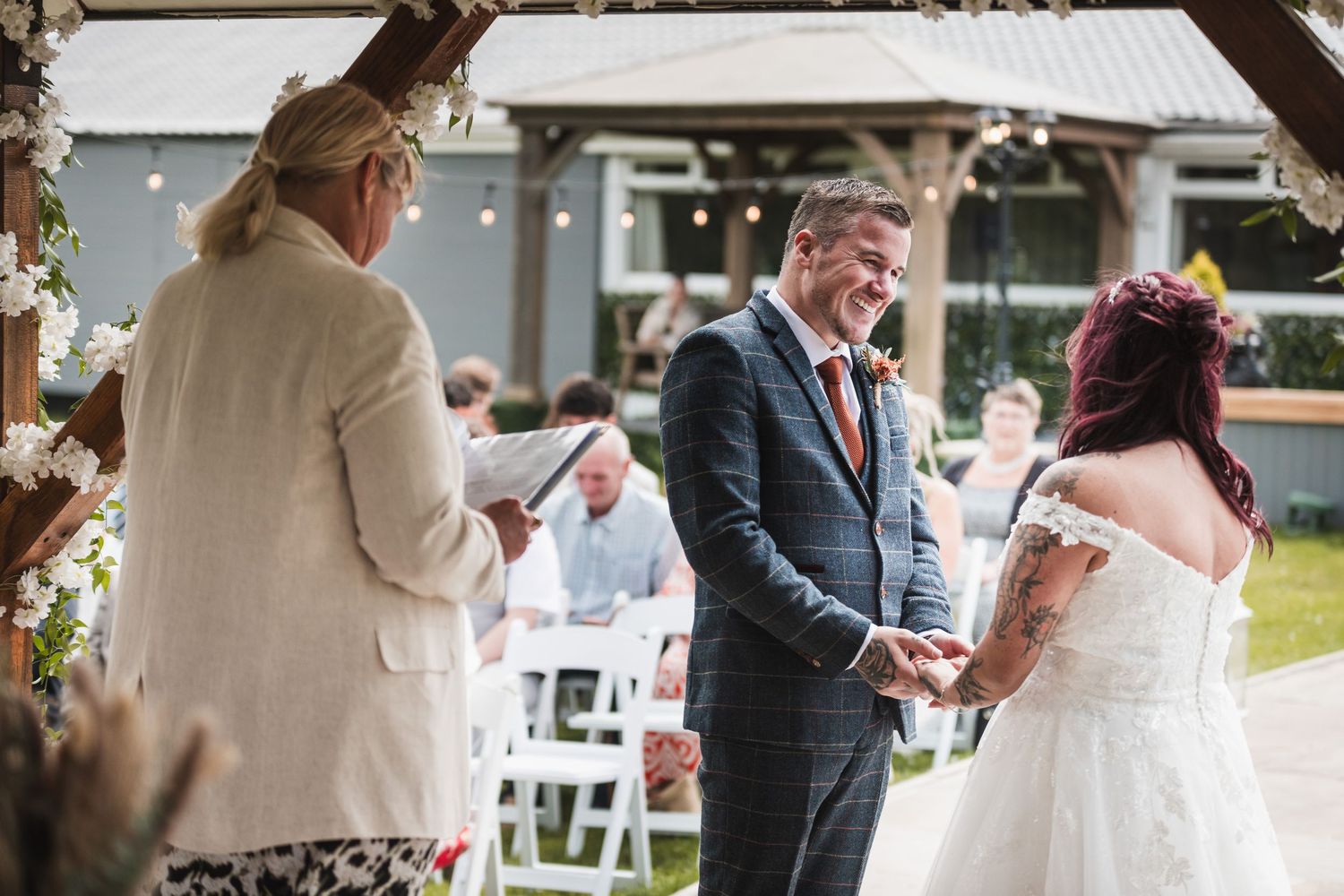 Wedding ceremony moments captured outdoors with guests in attendance. Ephemera.