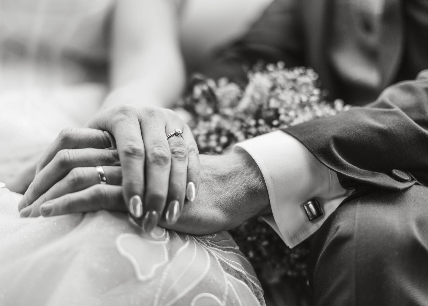 Black and white detail shots of hands and wedding dress fabric. Ephemera.