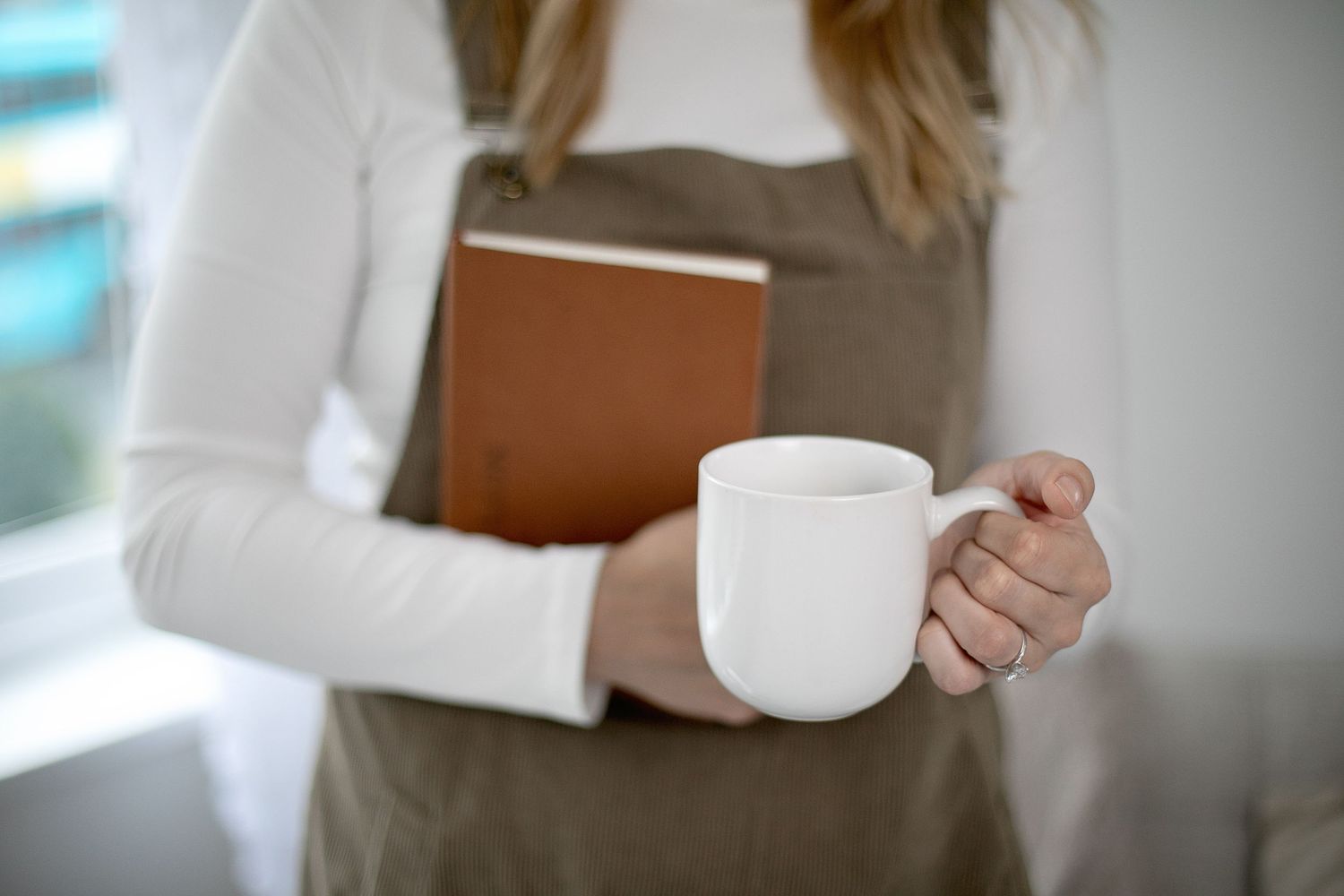Lifestyle product photography featuring books and coffee cups in natural light. Ephemera.