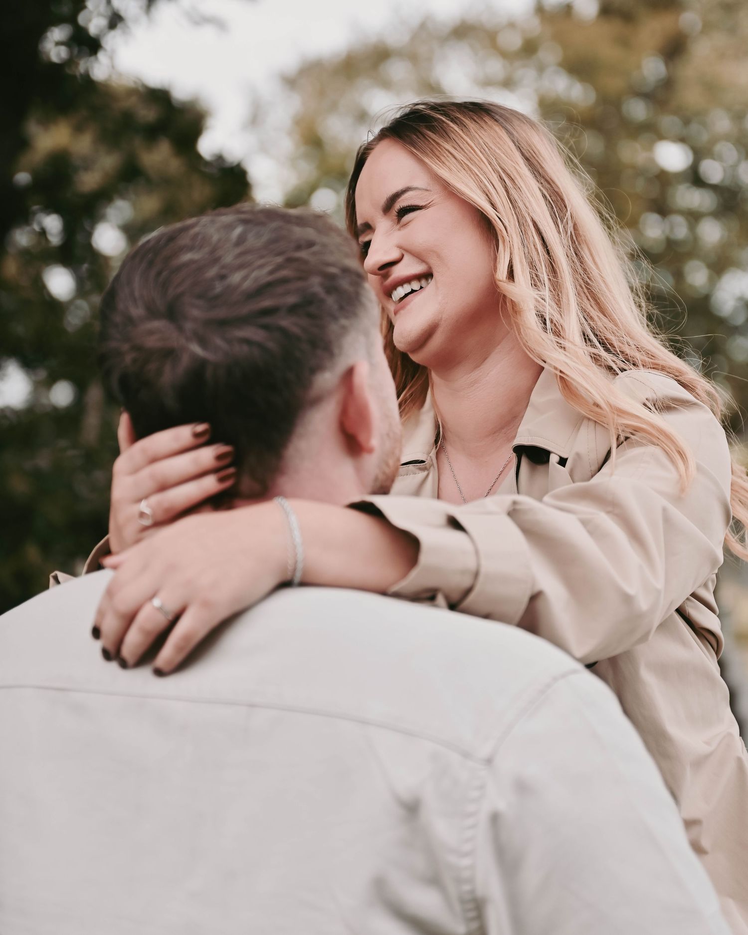 Candid moment of couple laughing and embracing outdoors in autumn. Ephemera.