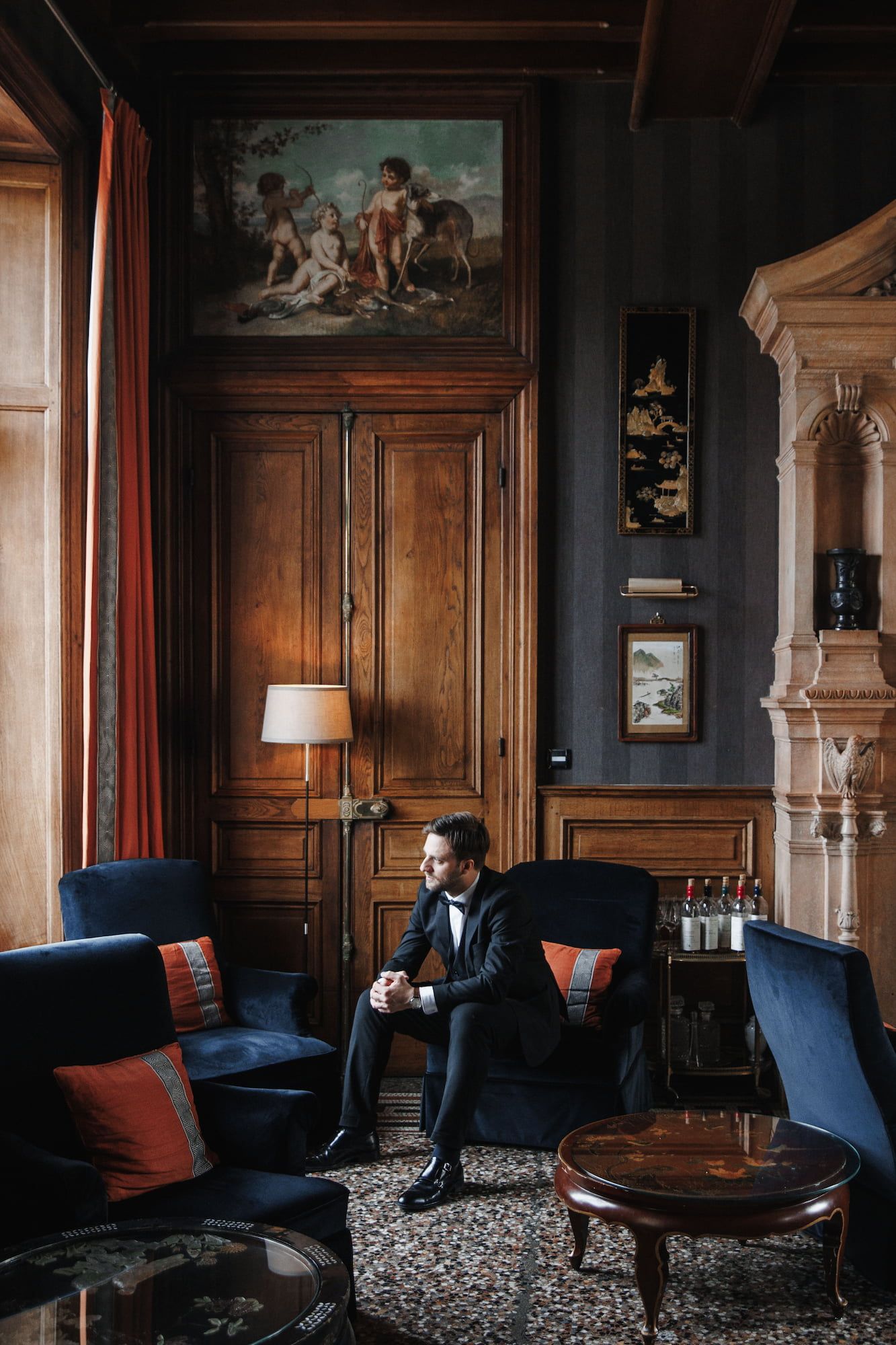 A groom sitting in the chair before the wedding in Barcelona begins.