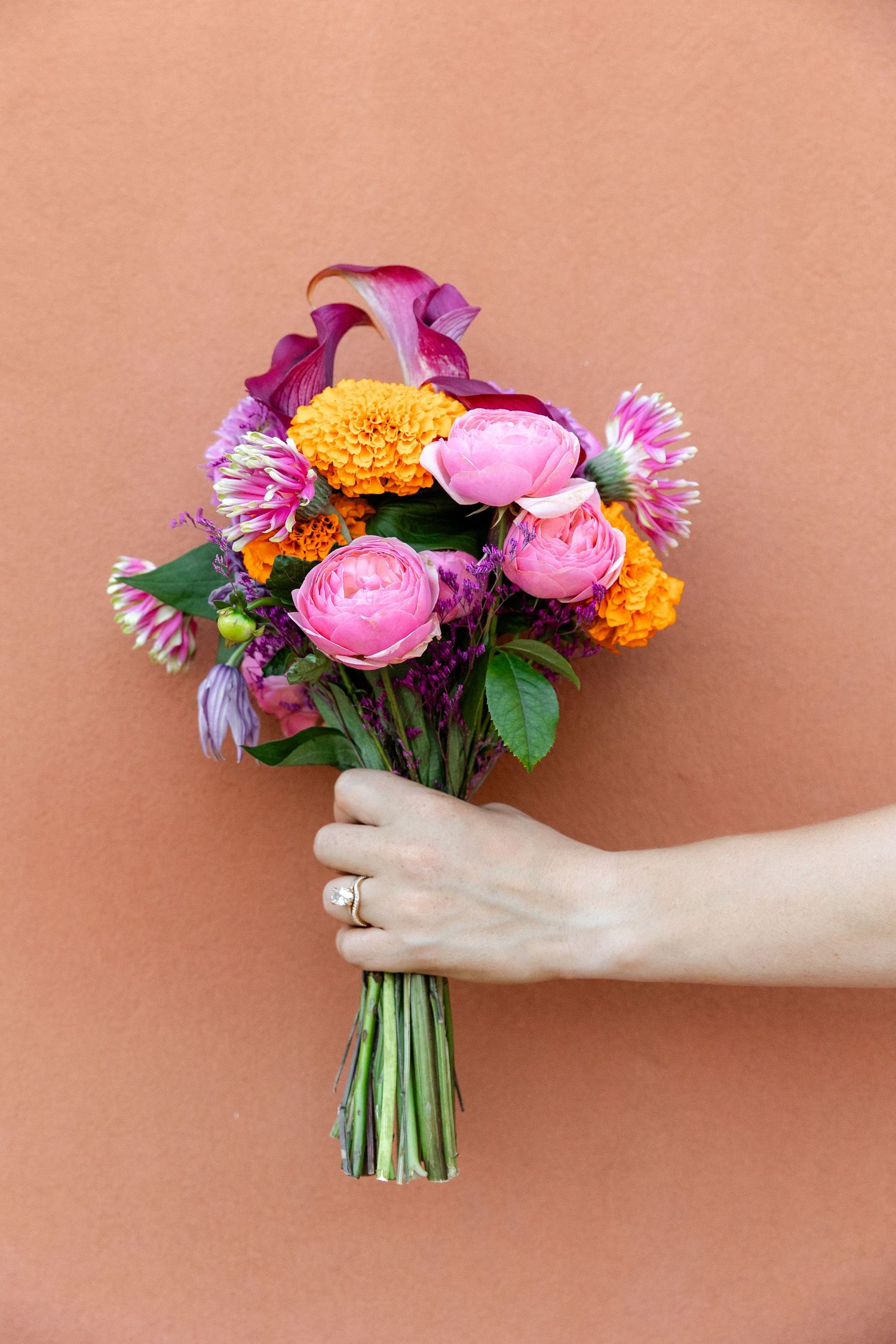 Vivid bridal bouquet with sophisticated design in summer style