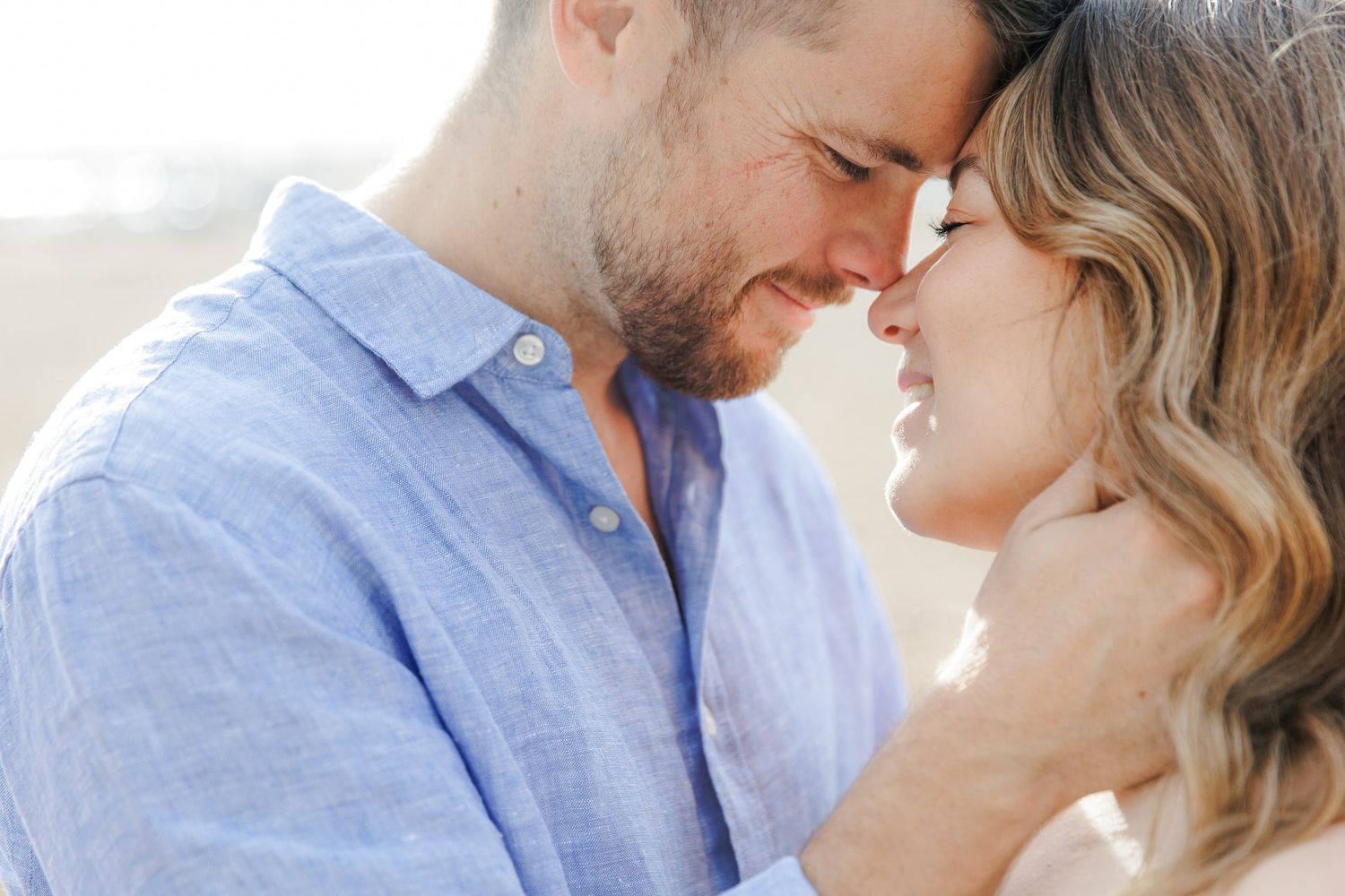 Photo of an engaged couple sharing a gentle kiss during their engagement shoot in Barcelona