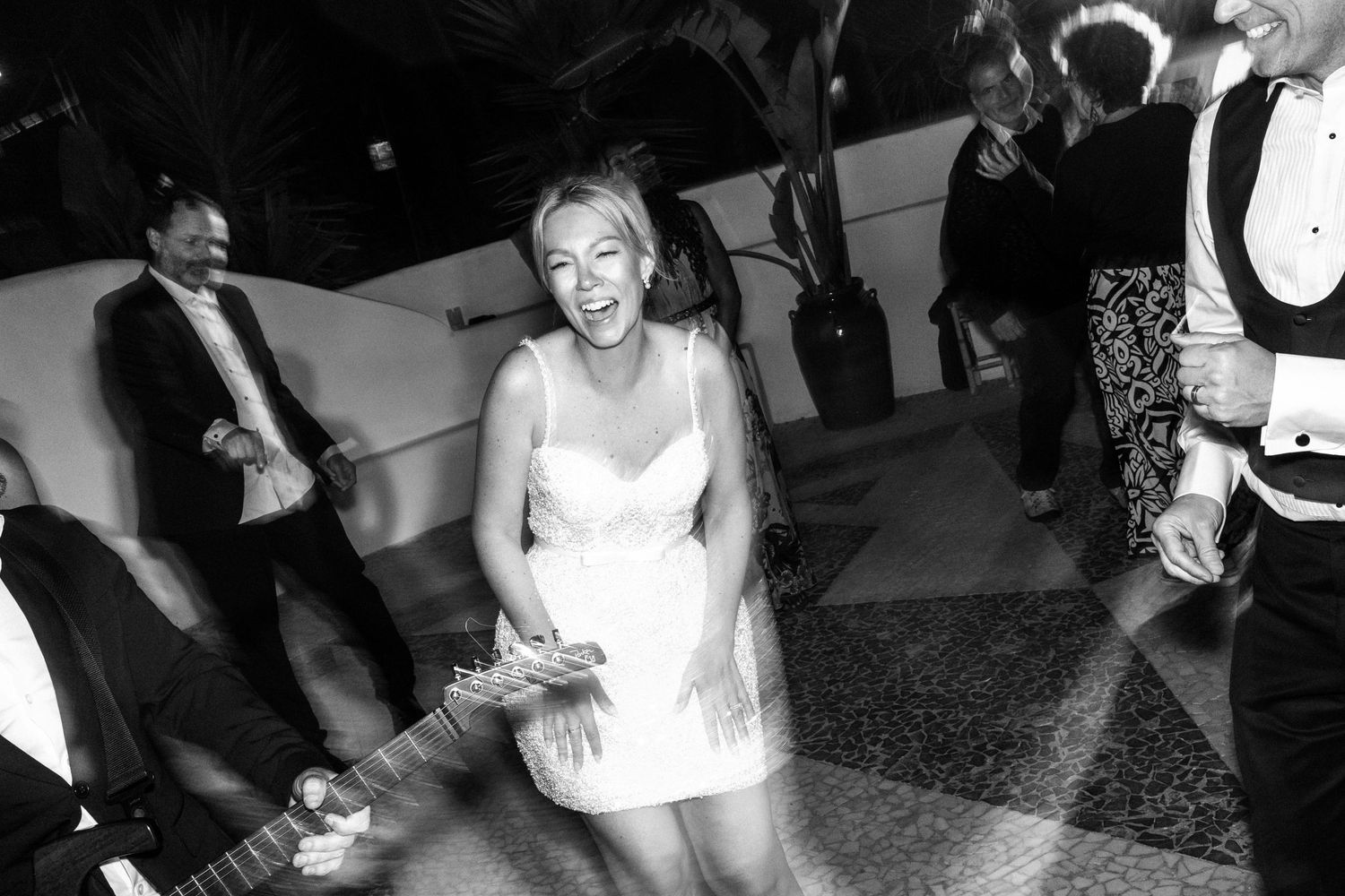 The bride is dancing during the wedding disco party