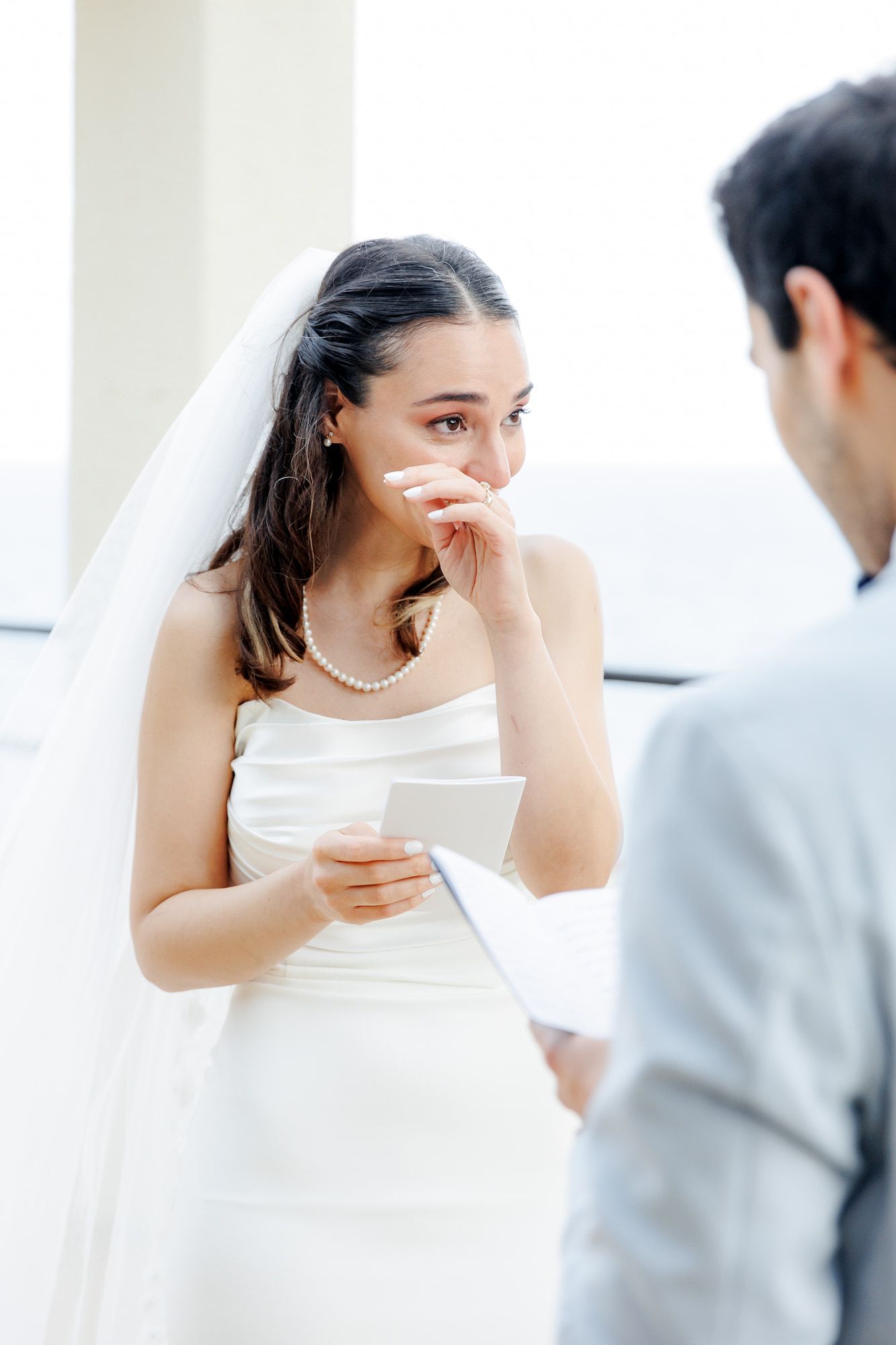 The bride is getting emotional during sharing her vows to the fiancé