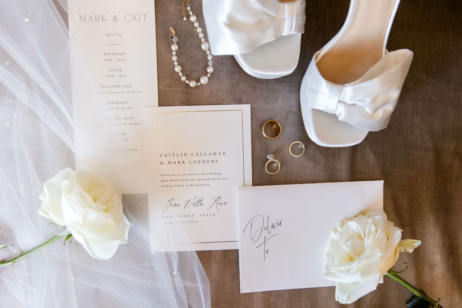 Close-up photo of bridal details: shoes, flowers, veil, and invitation cards.