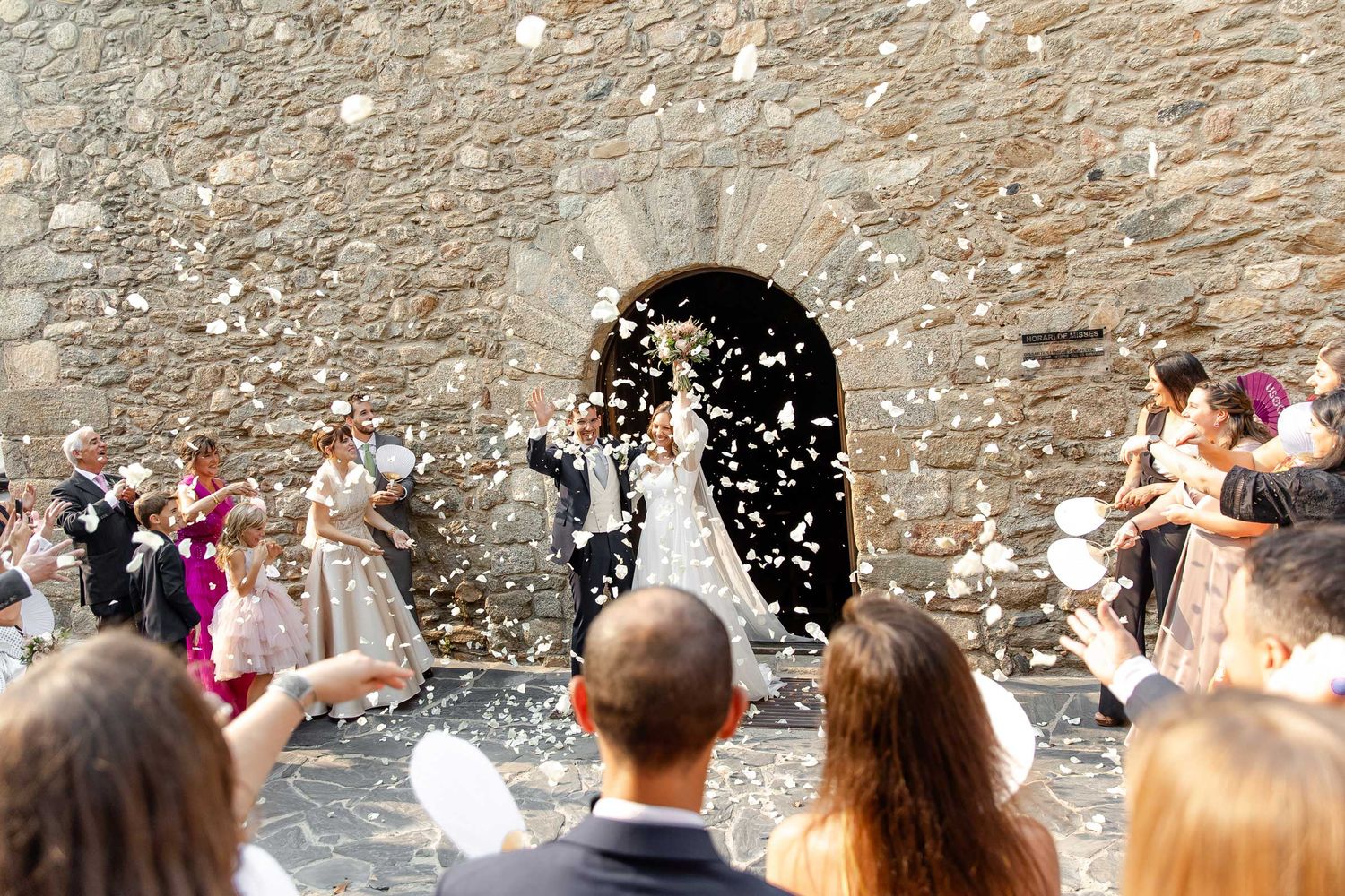 A couple leaving the church after the religious wedding ceremony in Girona, Barcelona