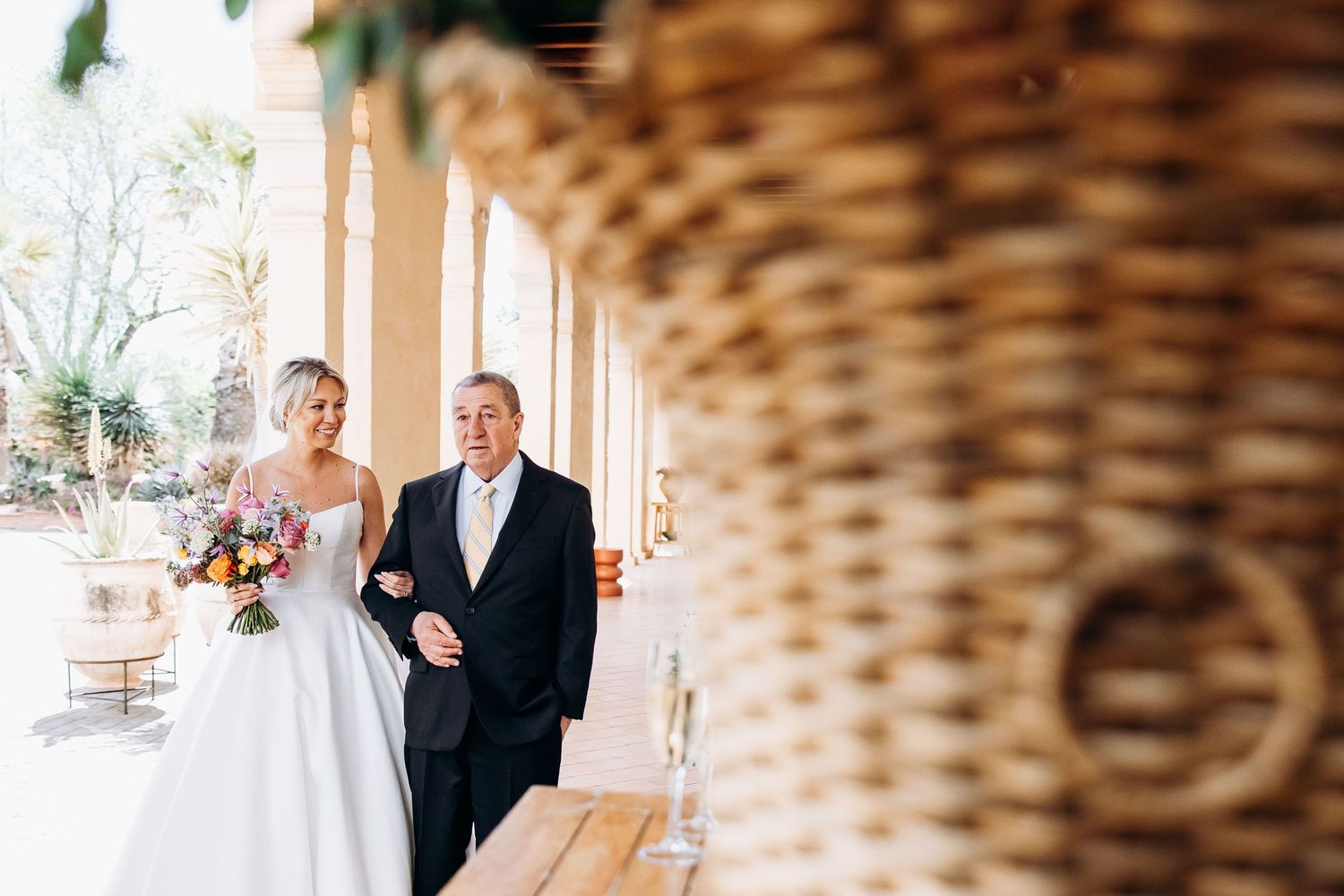 The bride's father accompanies her to the ceremony to meet the groom.