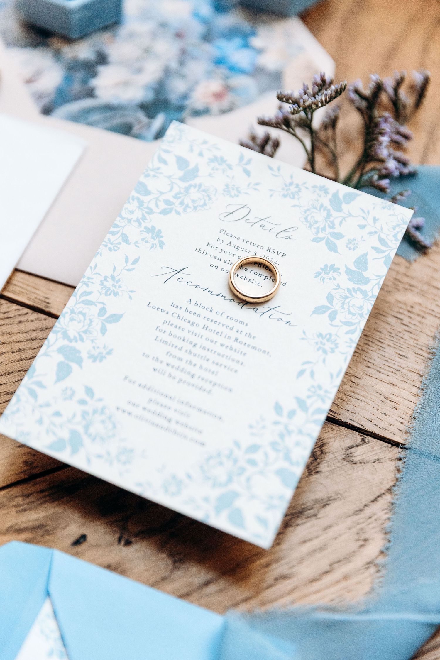 Refined wedding invitation with the wedding ring on top