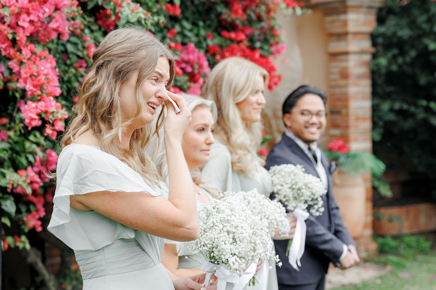 An emotional moment for the bridesmaids, as they cry while seeing their best friend get married.