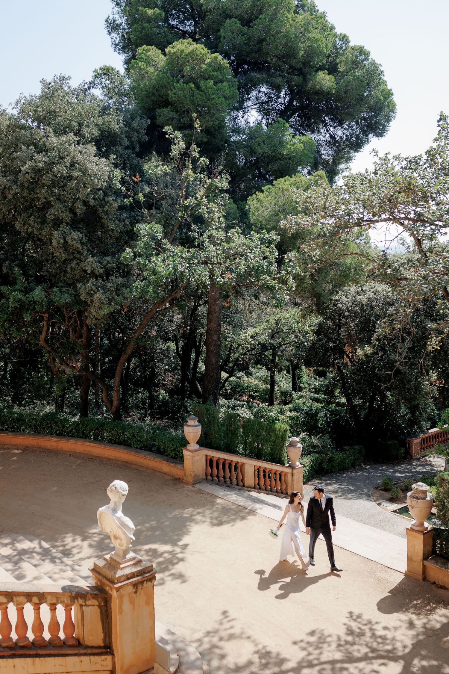 A newly married couple takes a morning walk before their legal ceremony at a church in Barcelona.
