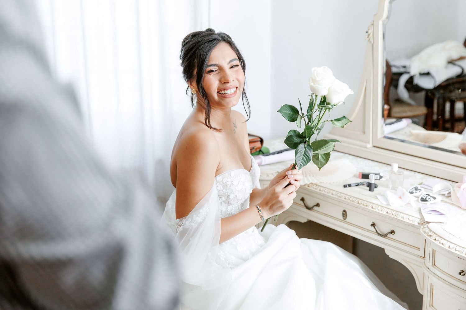 The happy bride enjoys the moment before she comes down to meet her future husband.