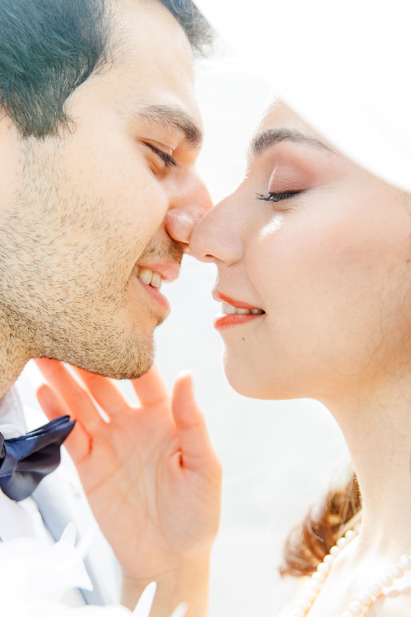 A girl touches the cheek of her fiancé