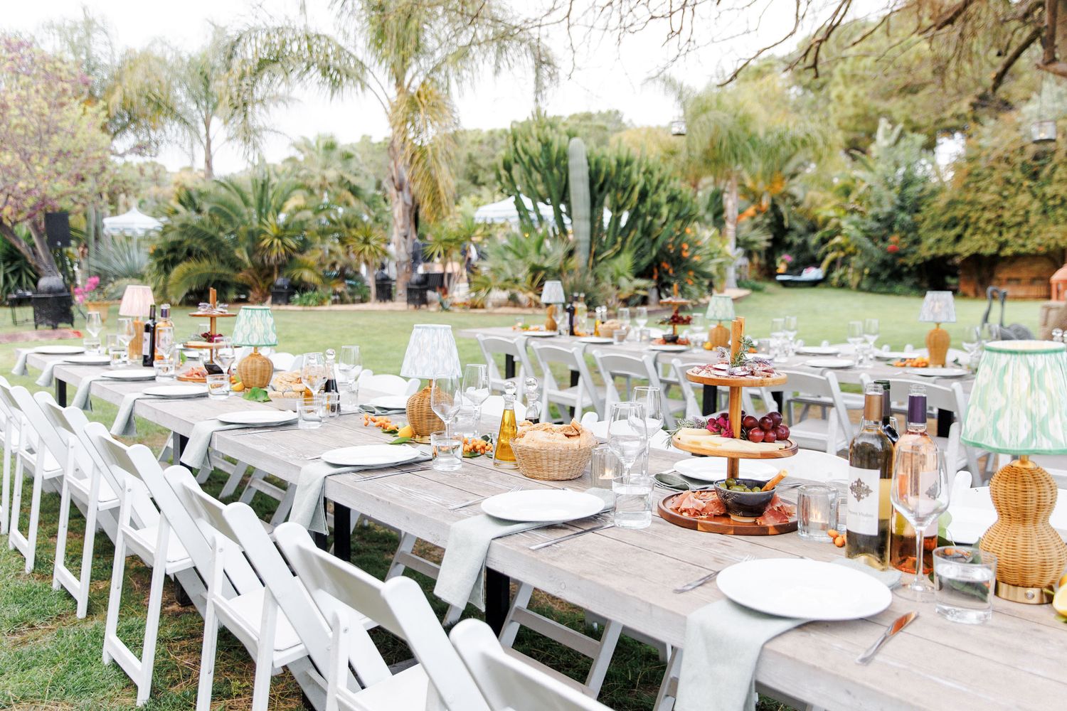 Tables decorated for outdoor rehearsal dinner at Gran Villa Rosa, Sitges