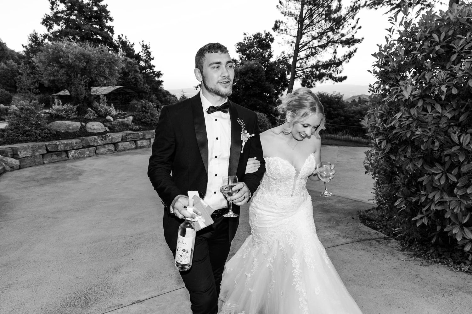 A candid moment of a couple walking up to the dinner area to meet the guests