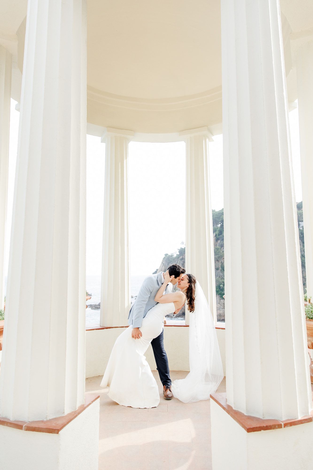Newlyweds after sharing vows at Marimurtra Botanical Garden near Barcelona