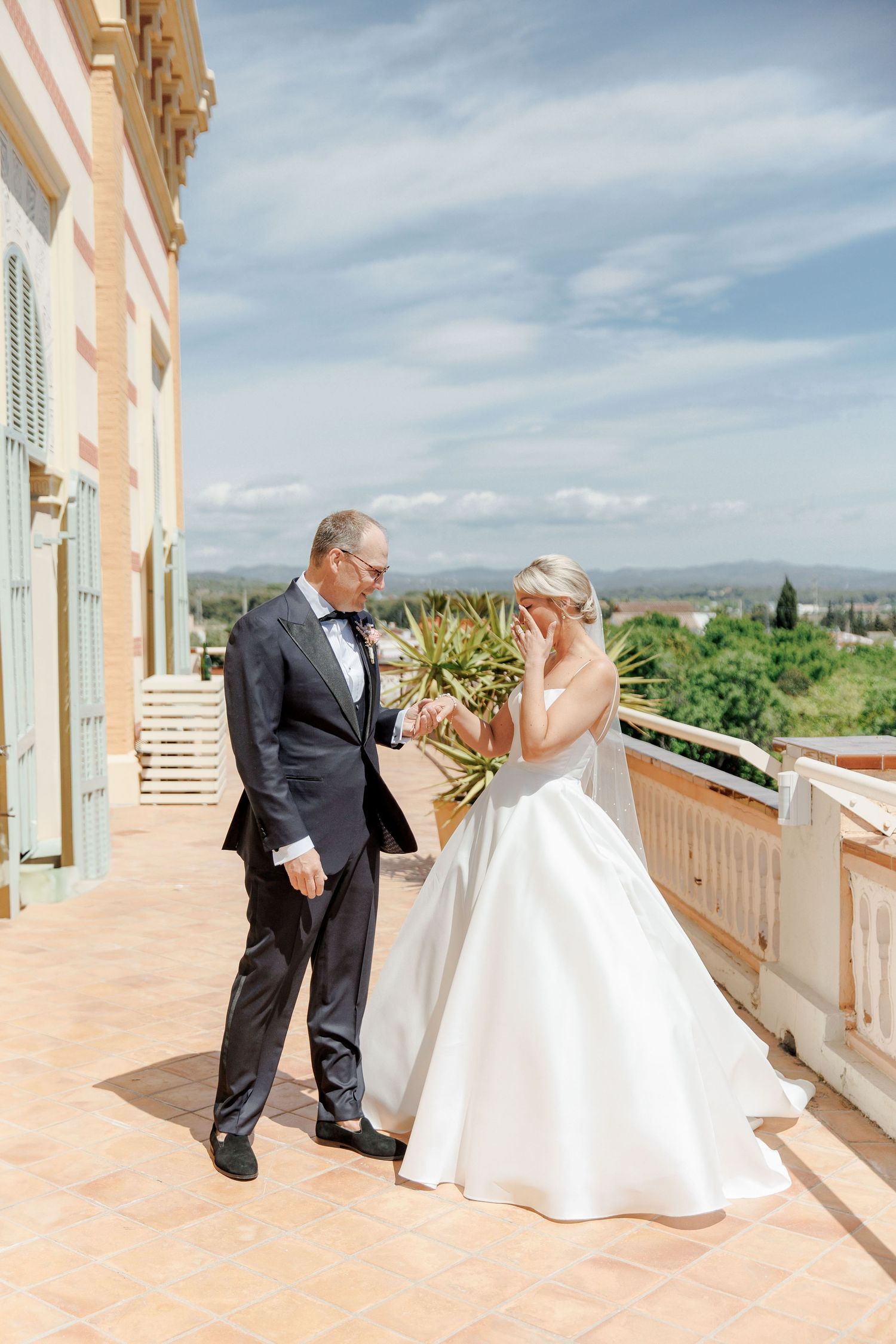 First look of the groom and bride at the terrace of Gran Villa Rosa