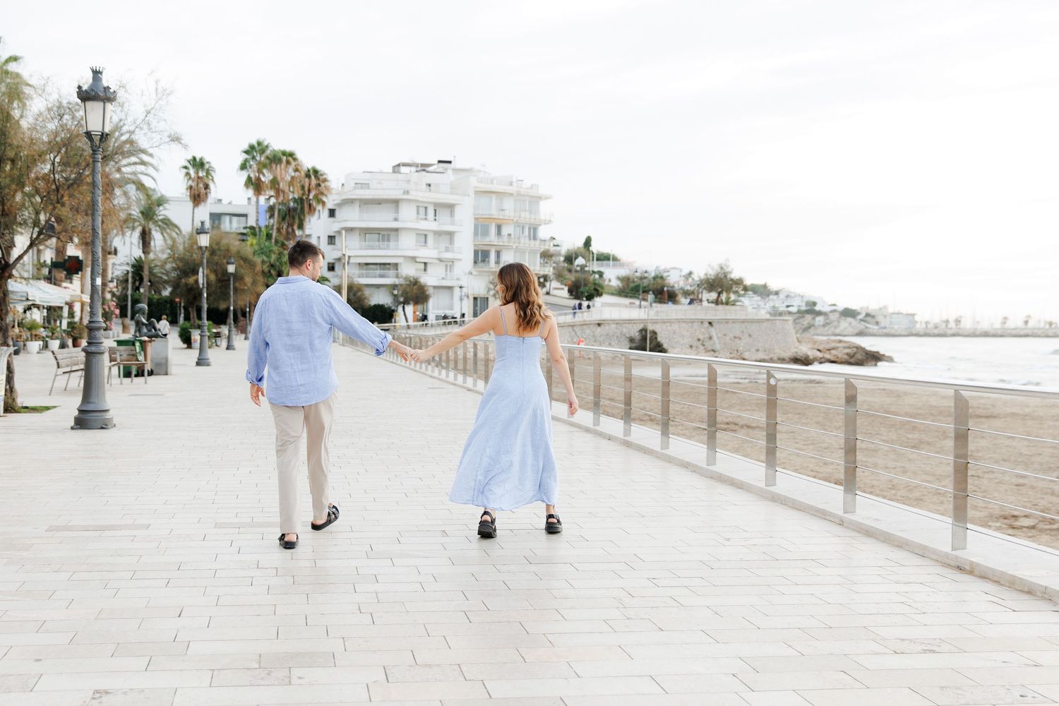 A couple enjoy their engagement photo session in Sitges, Barcelona