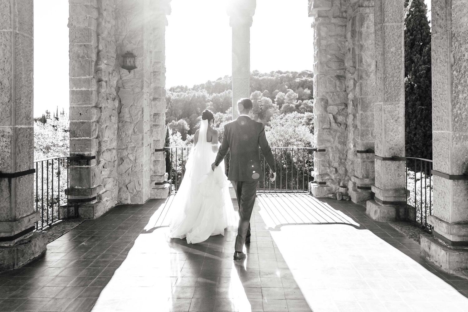 The married couple has a private time during golden hour on the balcony of La Baronia venue.