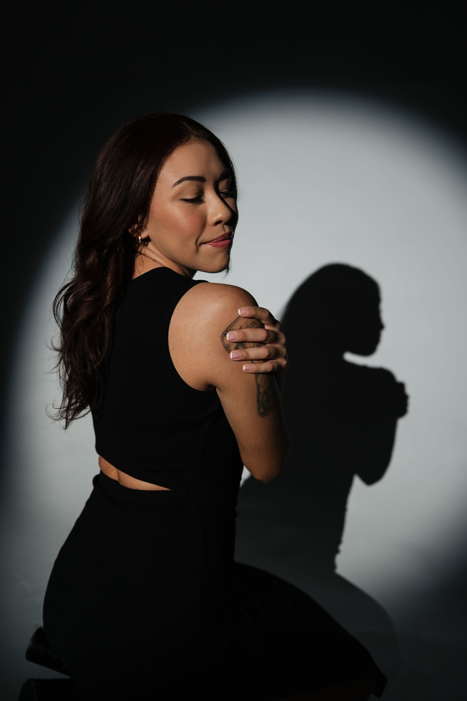 Moody portrait series showing silhouette and dramatic side lighting effects.