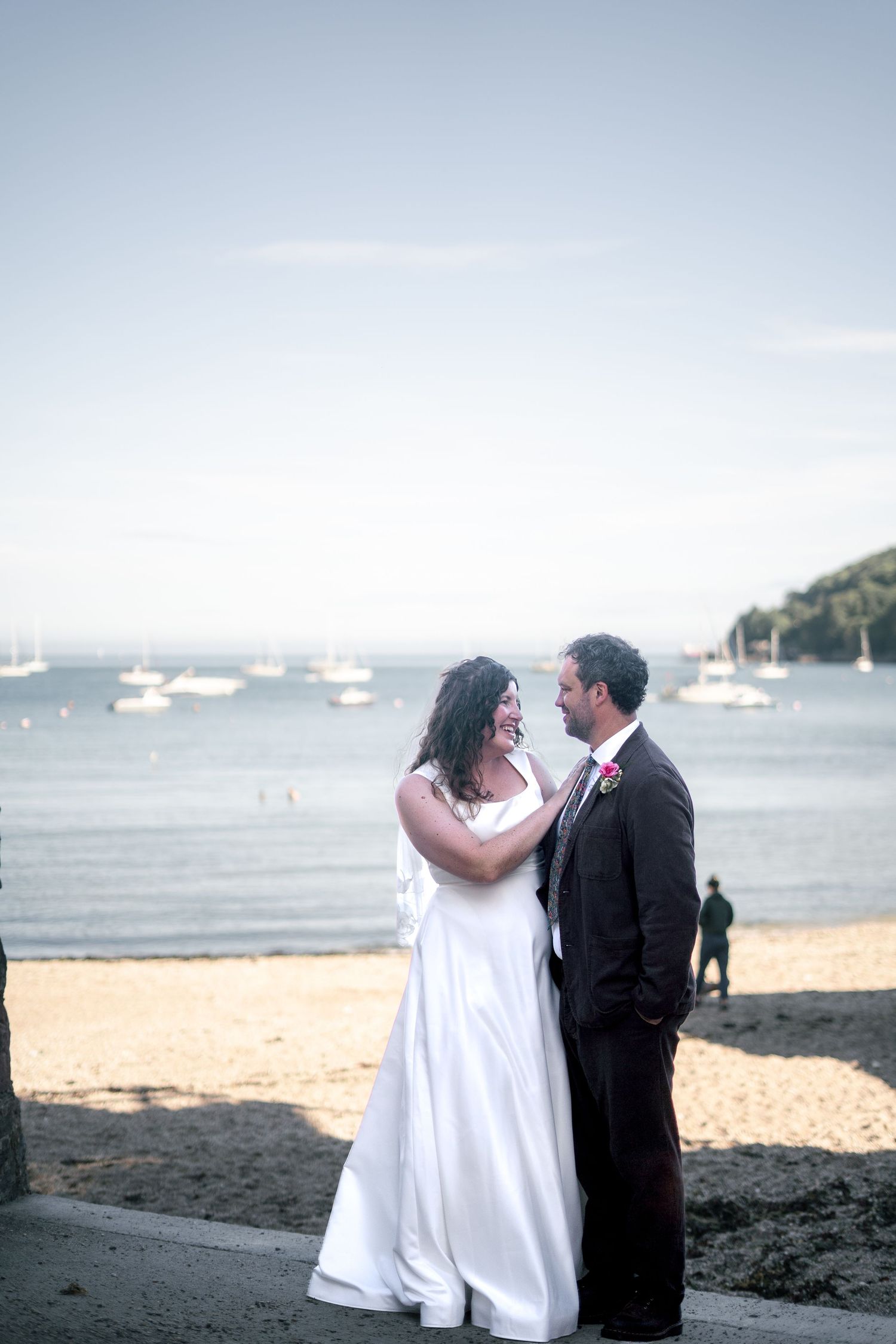 Bride and groom on the beach during their Cornish wedding