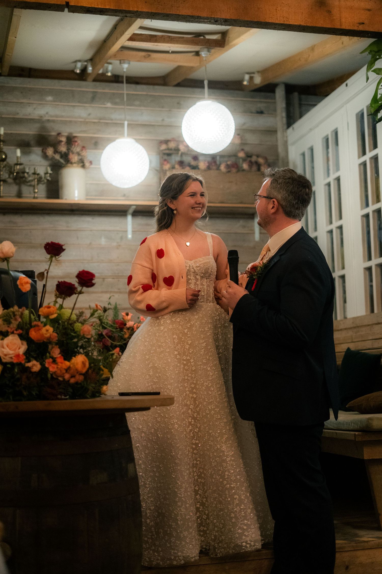 Bride and groom giving speech at their wedding reception, held at 45 Queen Street after their ceremony in Penzance Church, Cornwall