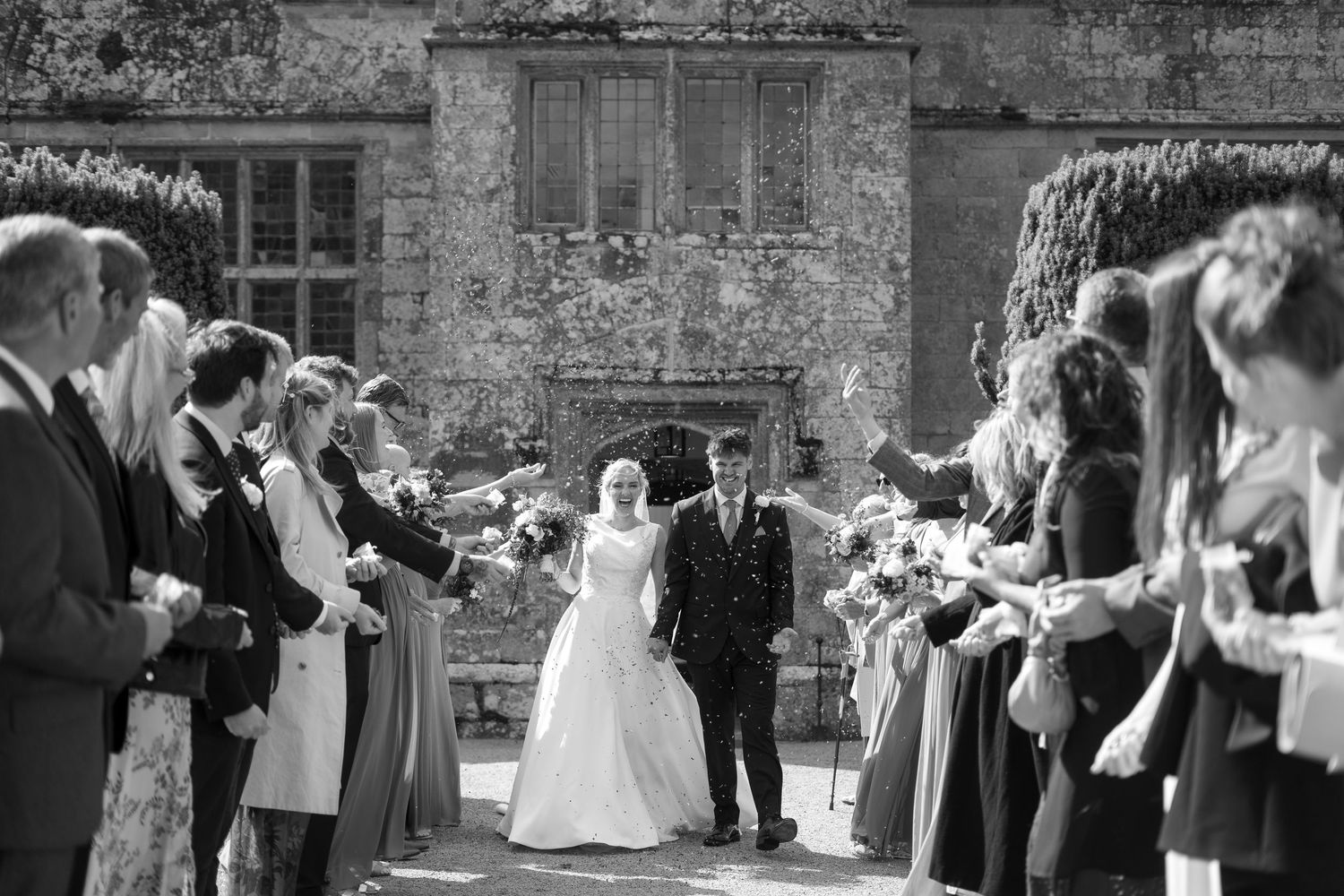 Black and white confetti photo at Trerice National Trust by Cornwall wedding photographer