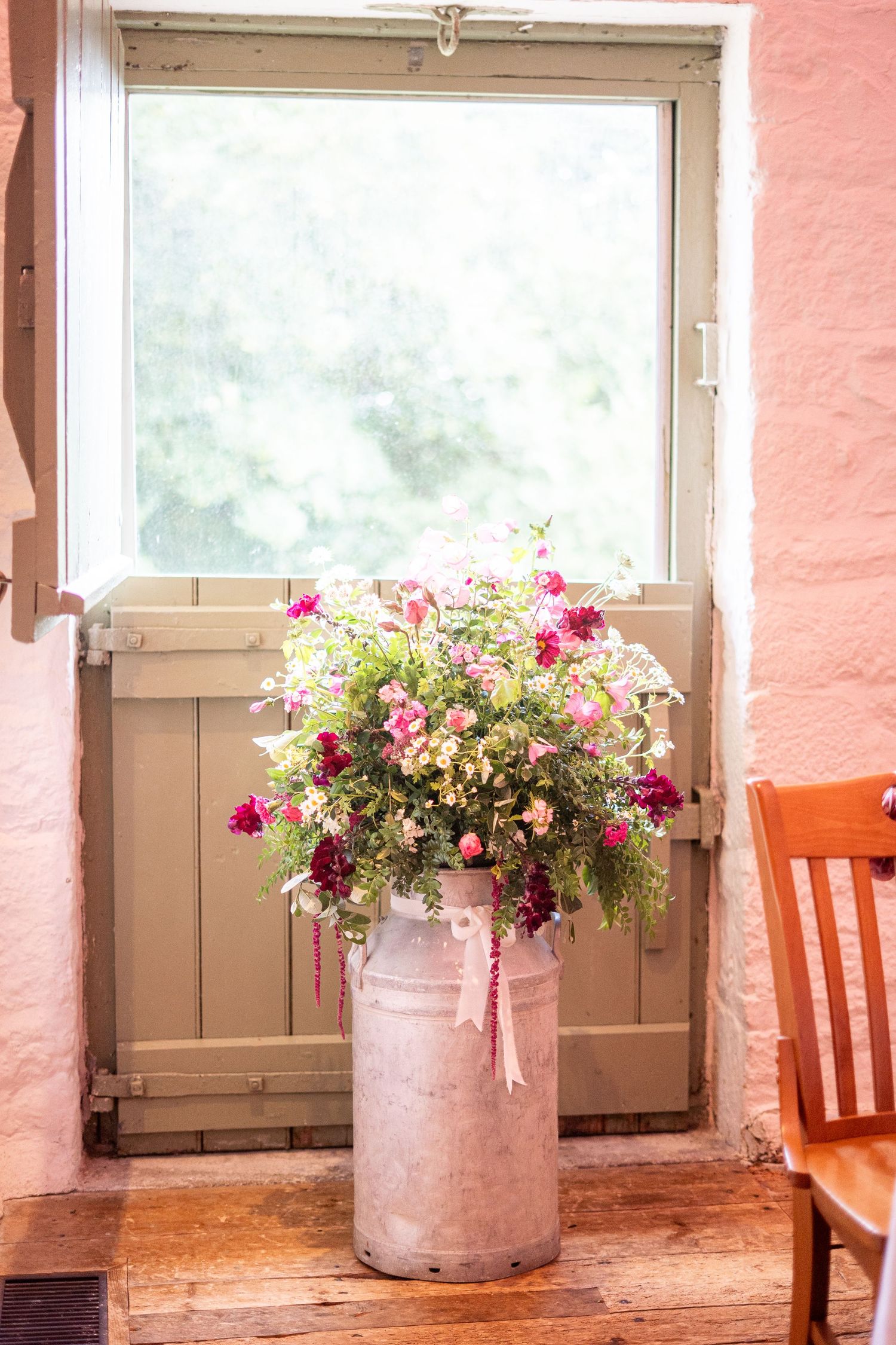 Beautiful floral display by Tregarrian Farm at a wedding at Trerice National Trust, Newquay