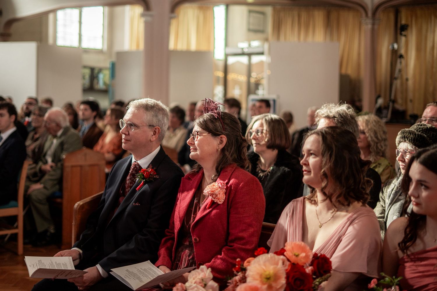 Wedding guests watching the ceremony during a church wedding in Penzance, Cornwall