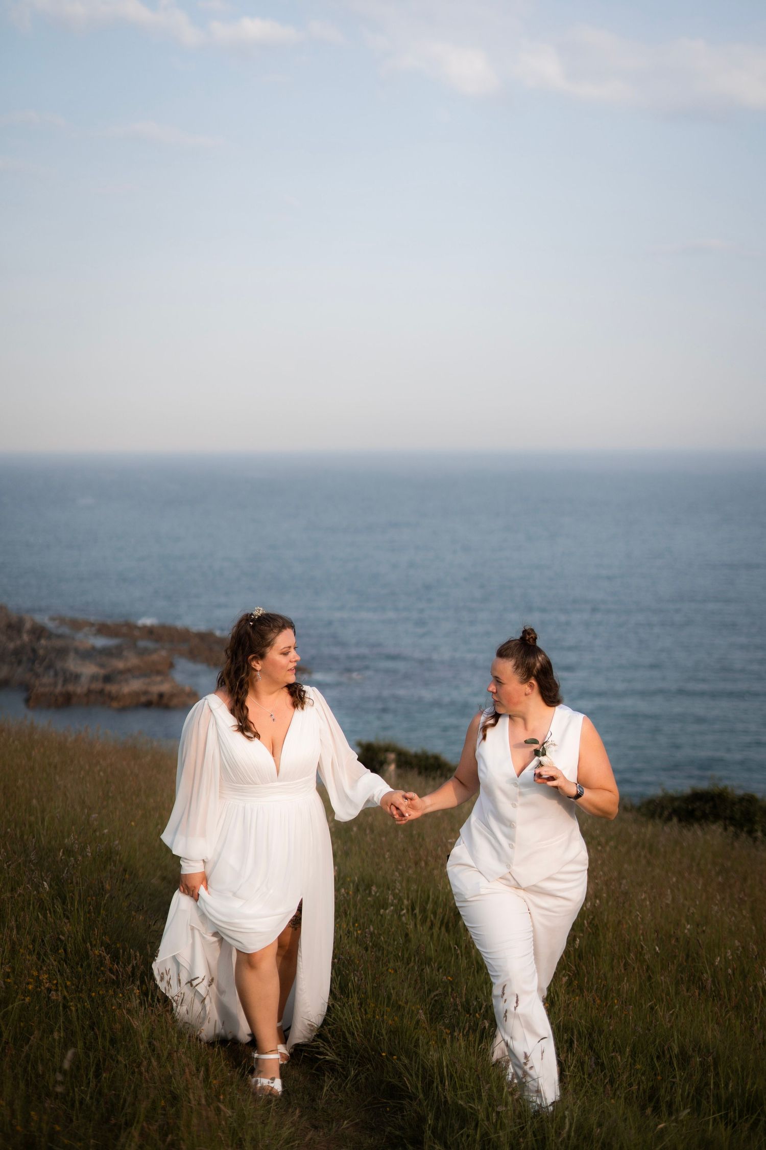 Tredudwell Manor lesbian wedding with a couples session on the cliffs of Lantic Bay
