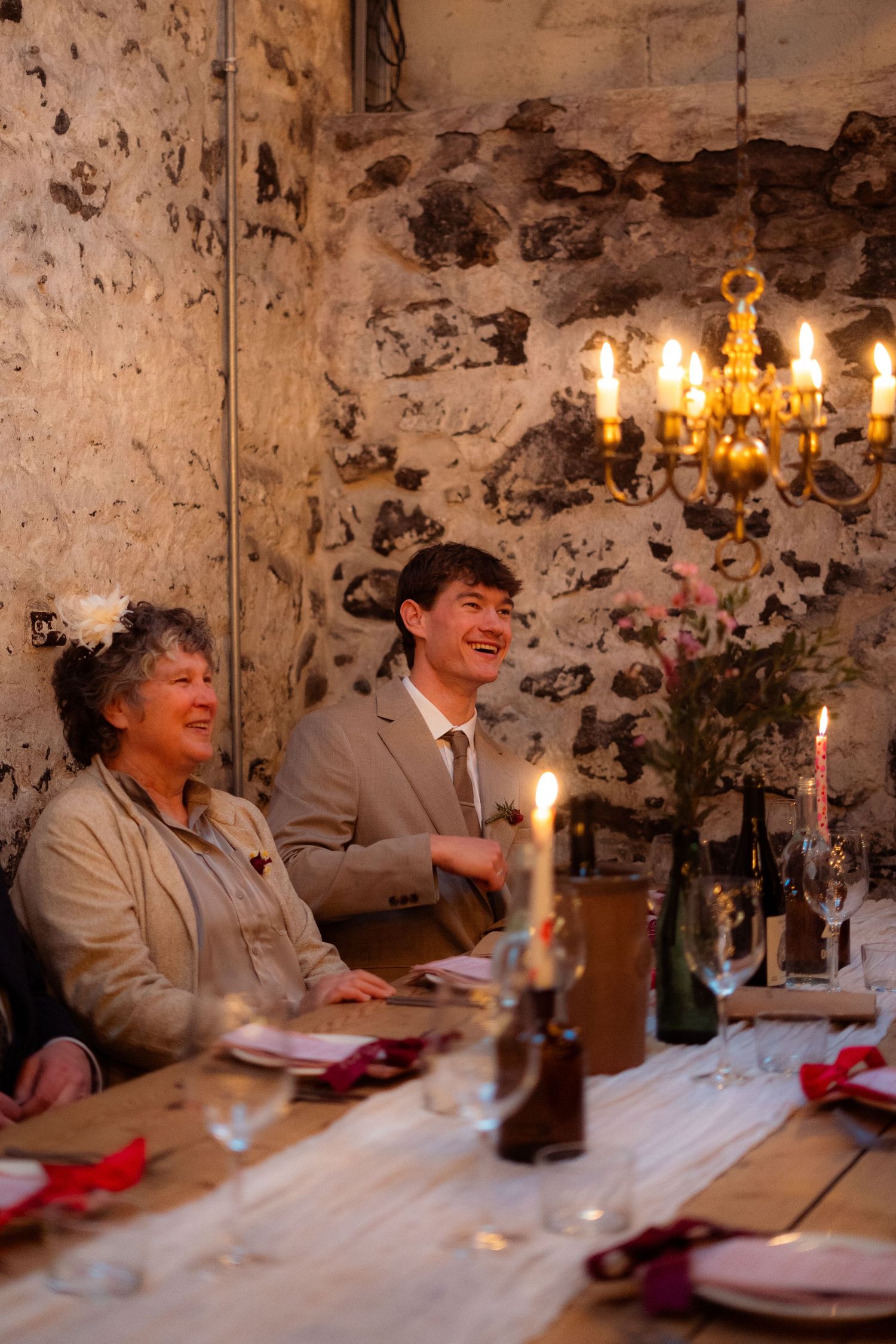 Candid photo of guests laughing, captured by Cornwall wedding photographer
