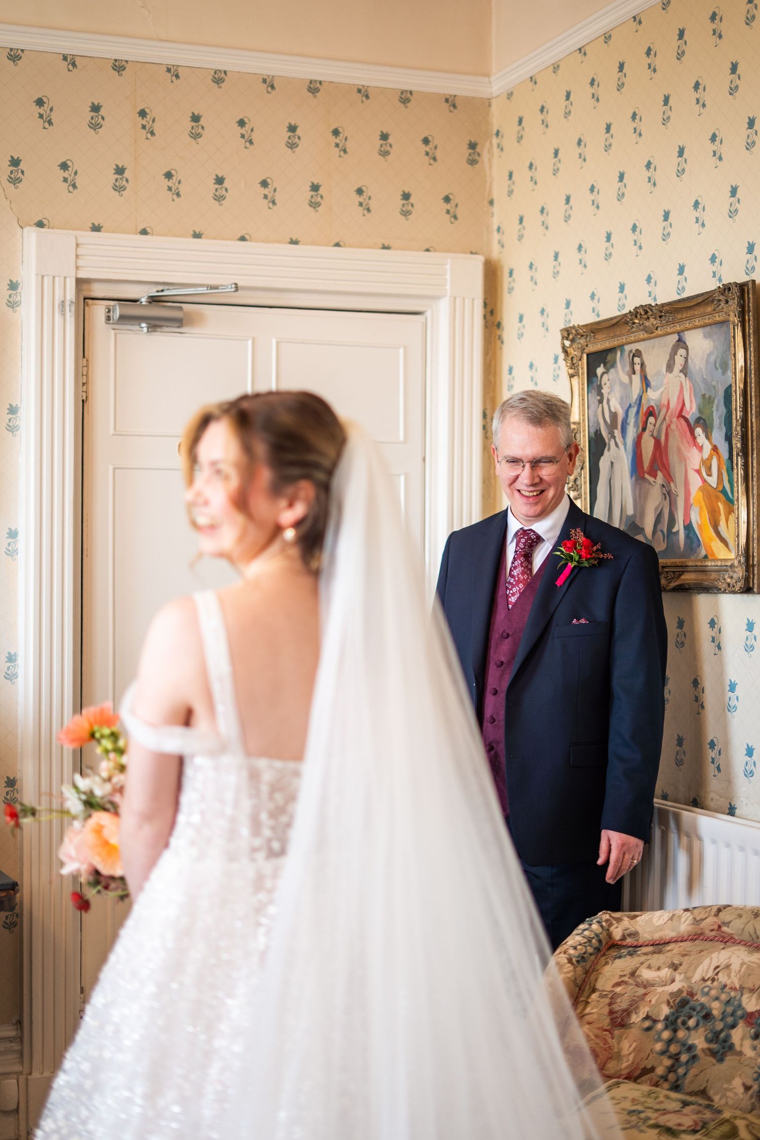 Candid photo of a first look between a bride and her father