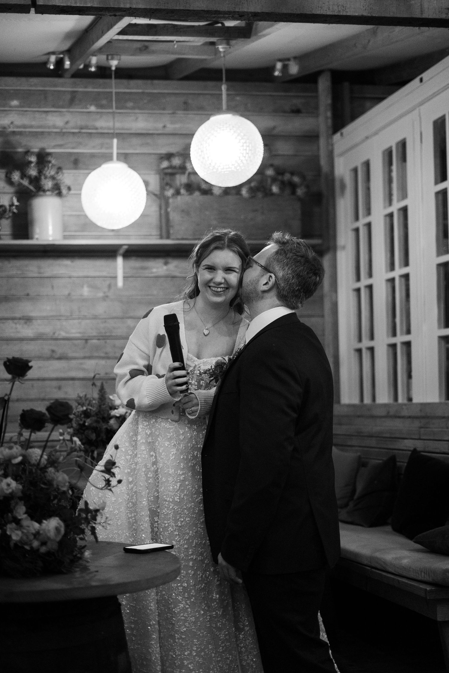 Bride and groom kiss during their wedding reception at 45 Queen Street after their ceremony in Penzance Church, Cornwall