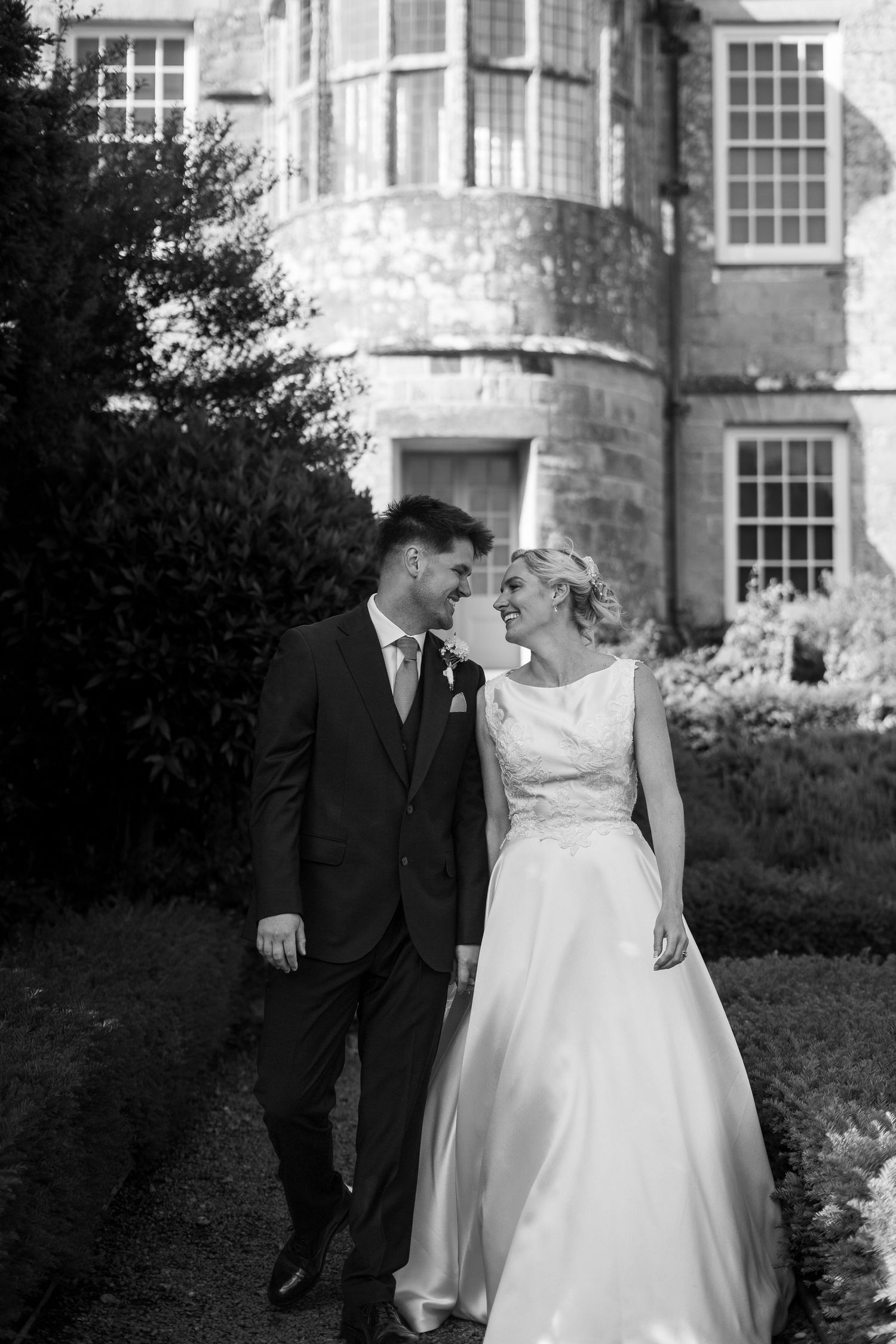Black and white photo of bride and groom on their wedding day at Trerice National Trust near Newquay, Cornwall