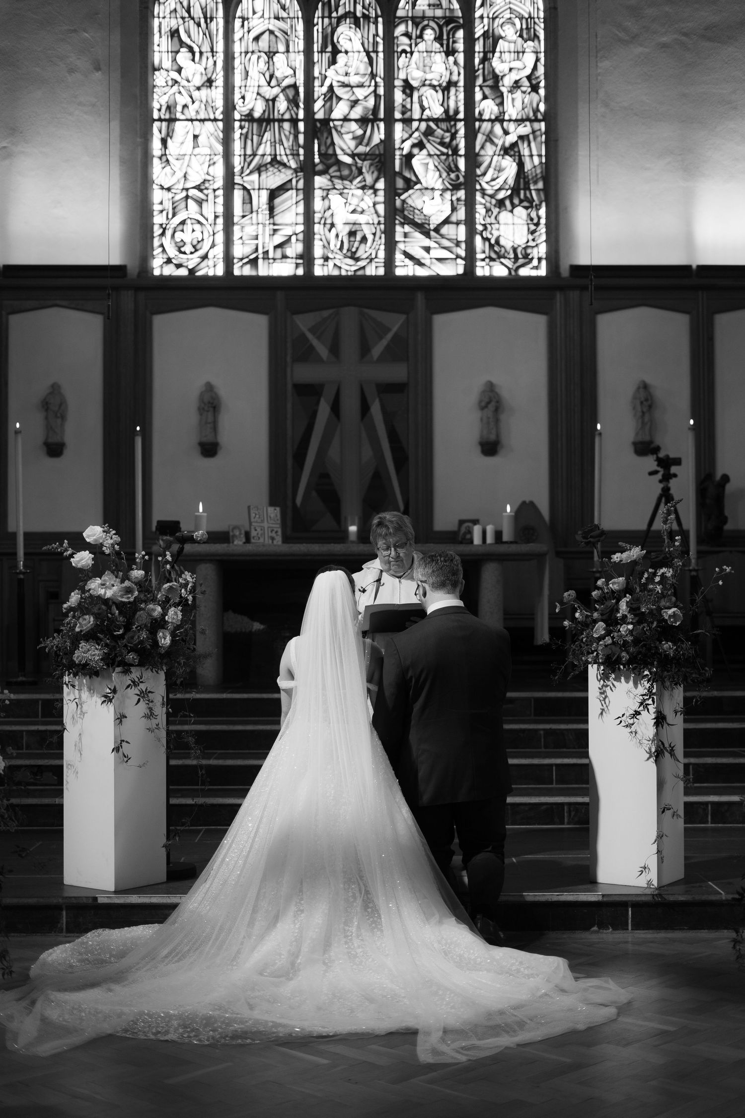 Black and white editorial photo during a church wedding in Penzance, Cornwall