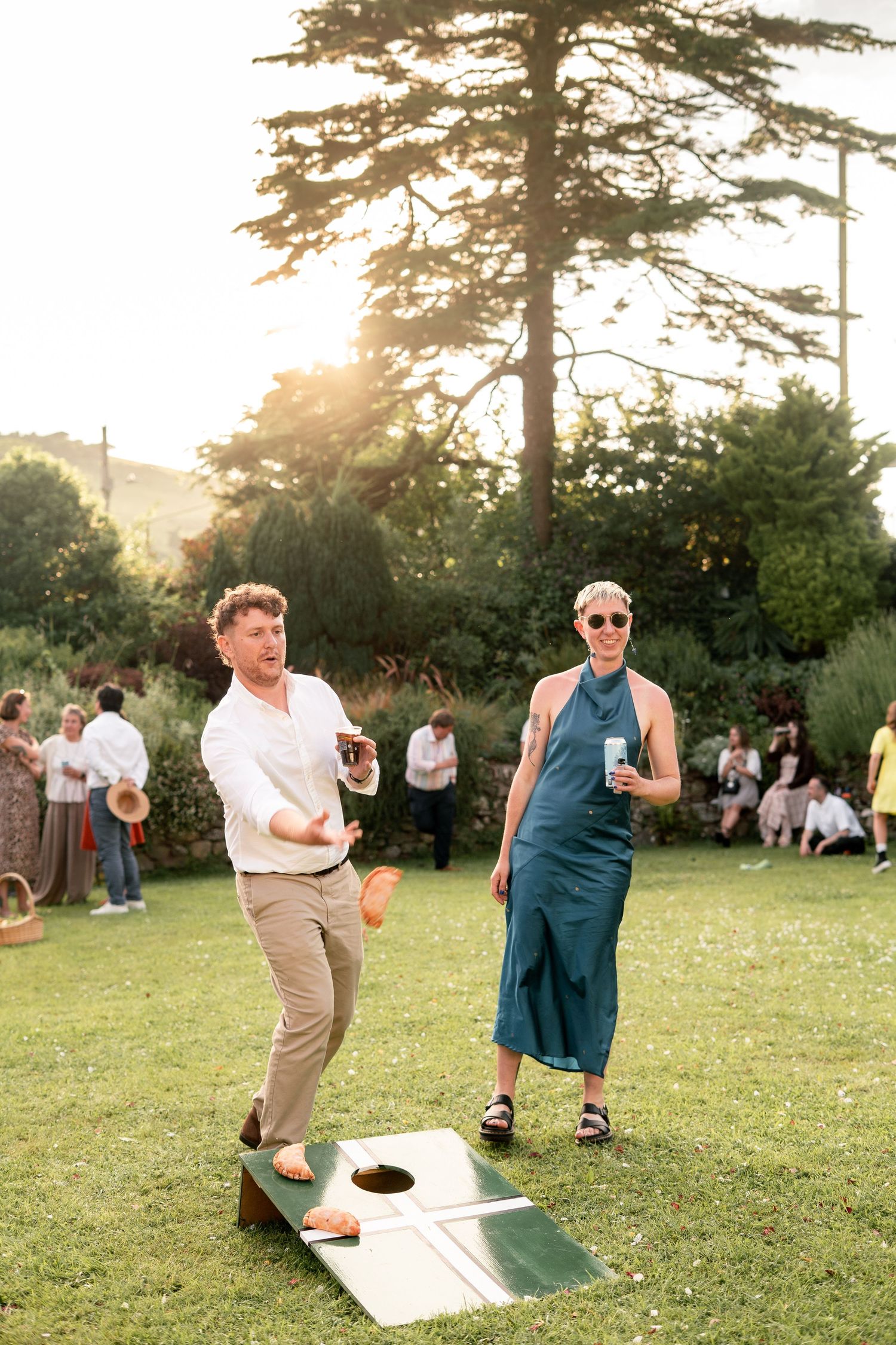 Guests playing garden games at a wedding in Cornwall