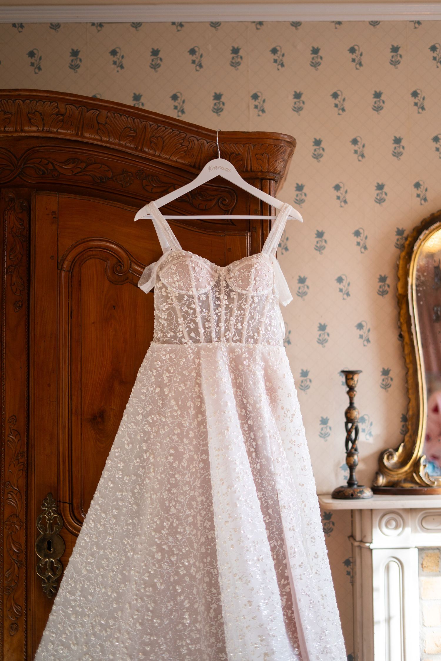 Come up of a wedding dress hanging on the wardrobe before a wedding day in Penzance, Cornwall