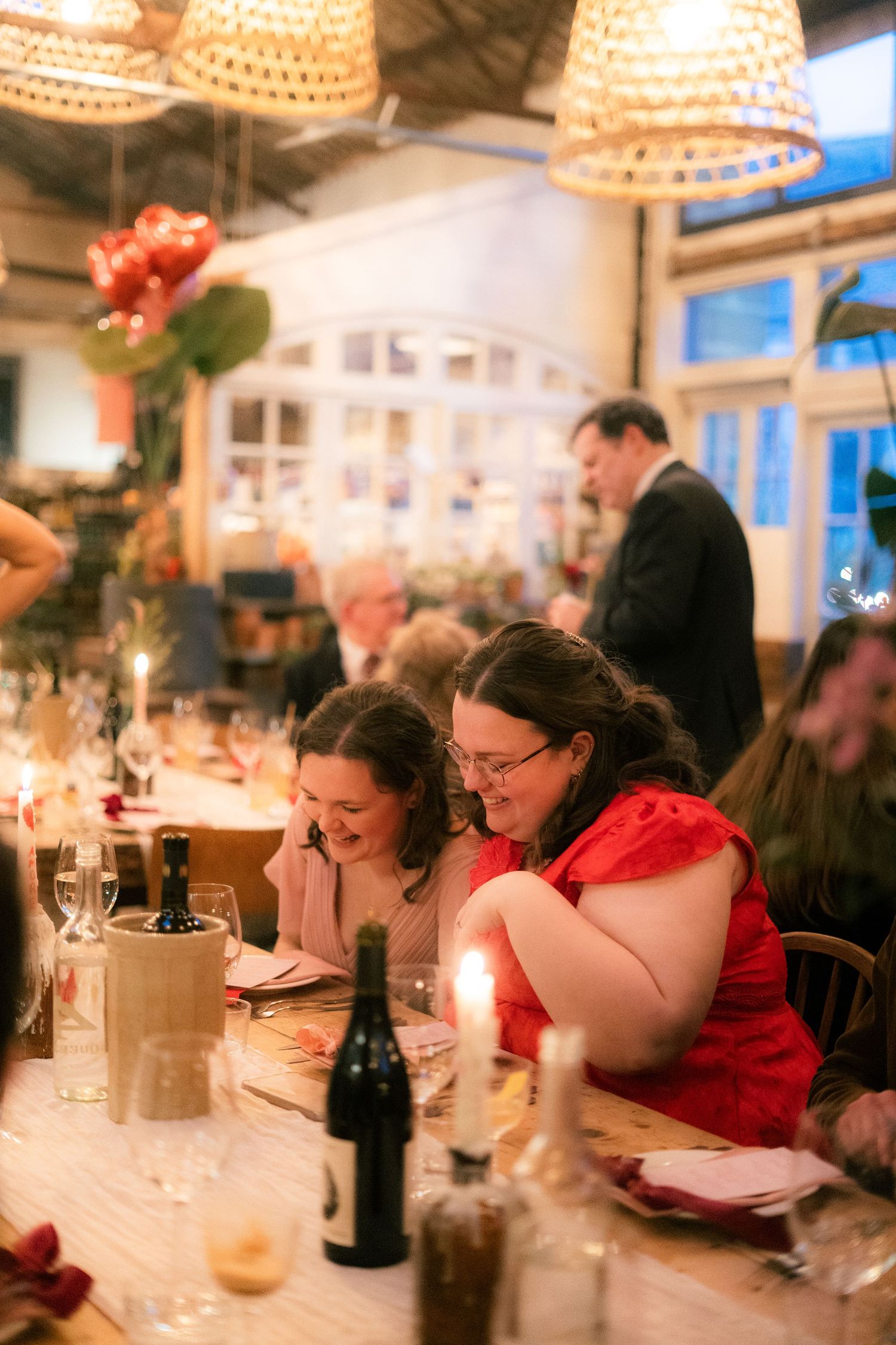 Wedding guests laughing at a wedding reception in Penzance, Cornwall