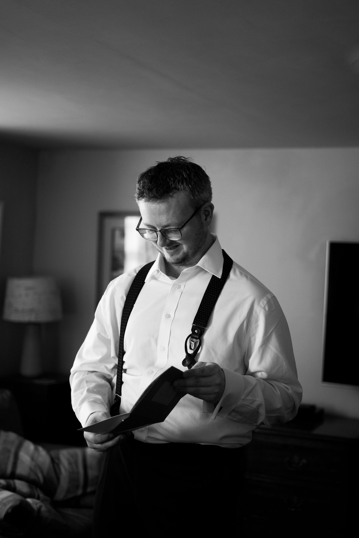 Editorial getting ready photo of a groom on his wedding day in Cornwall