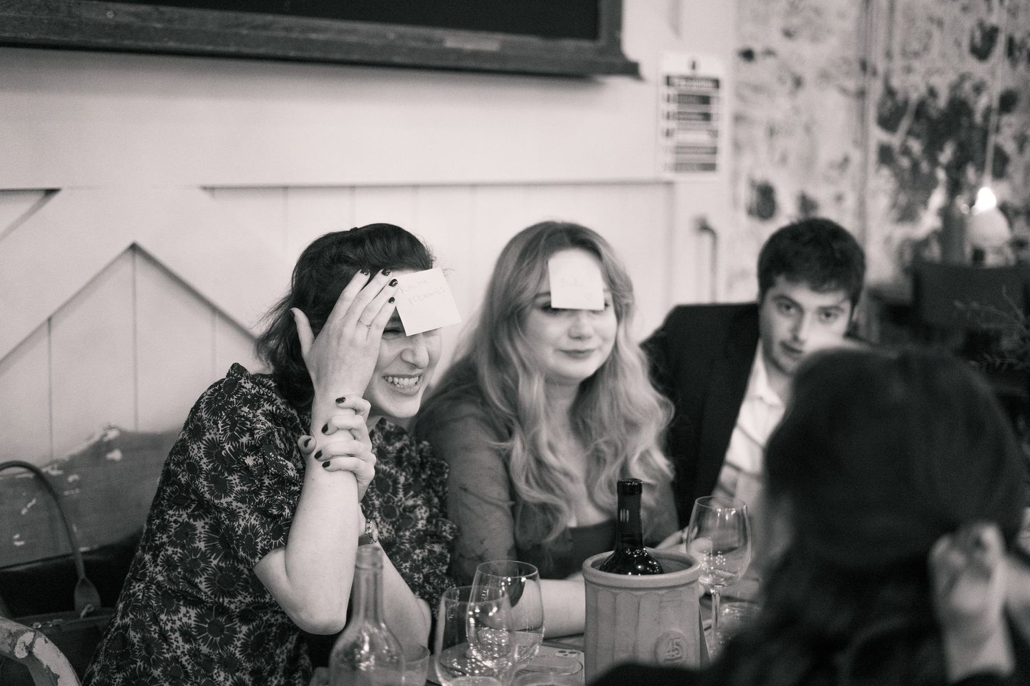 Candid photo of wedding guests playing games during reception at 45 Queen Street, Penzance, Cornwall