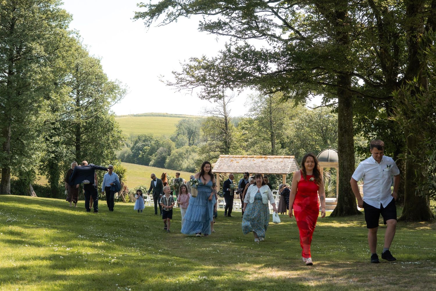 Guests in the garden of Tredudwell Manor wedding venue, Cornwall