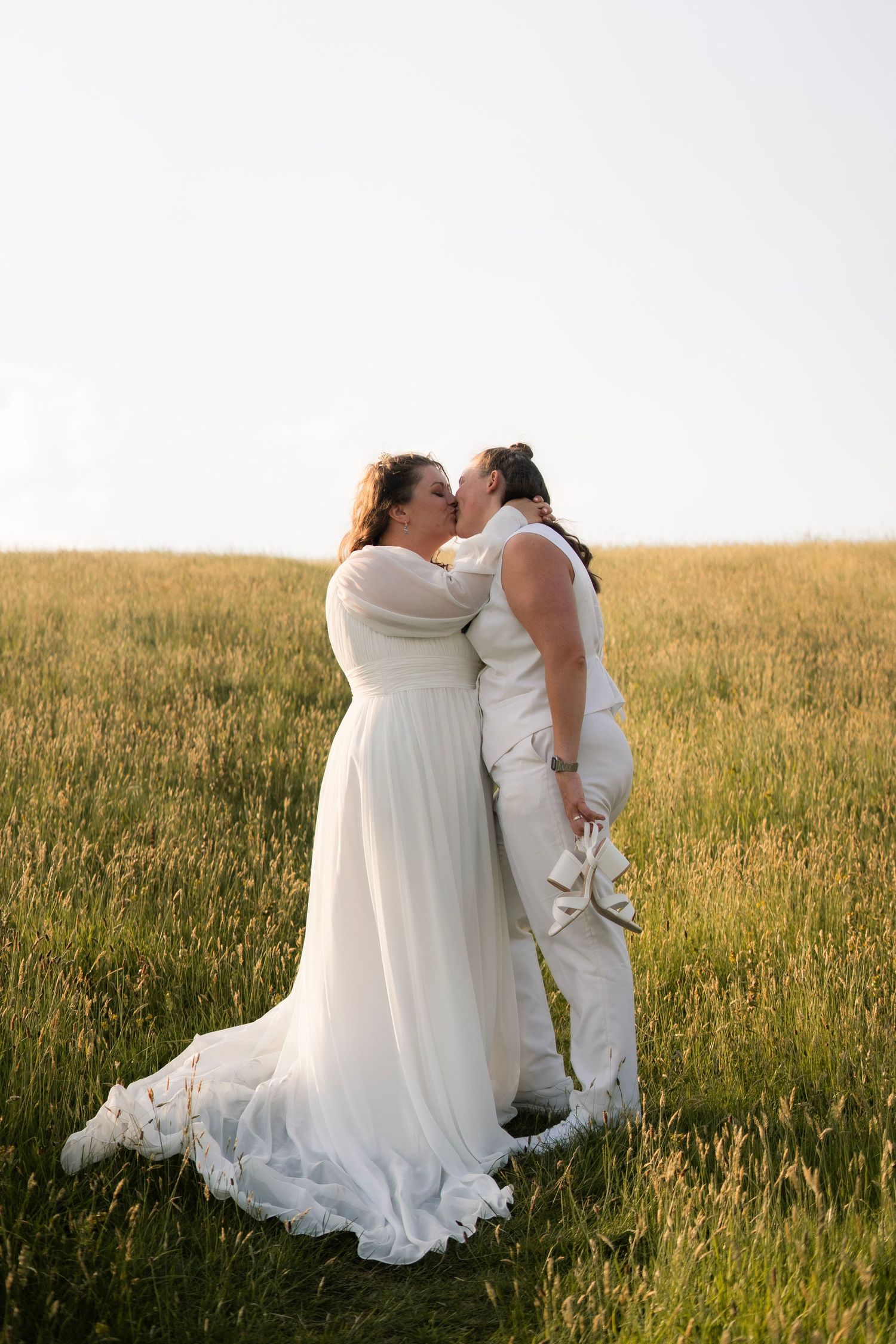 Brides kissing on their wedding day at Tredudwell Manor, Cornwall