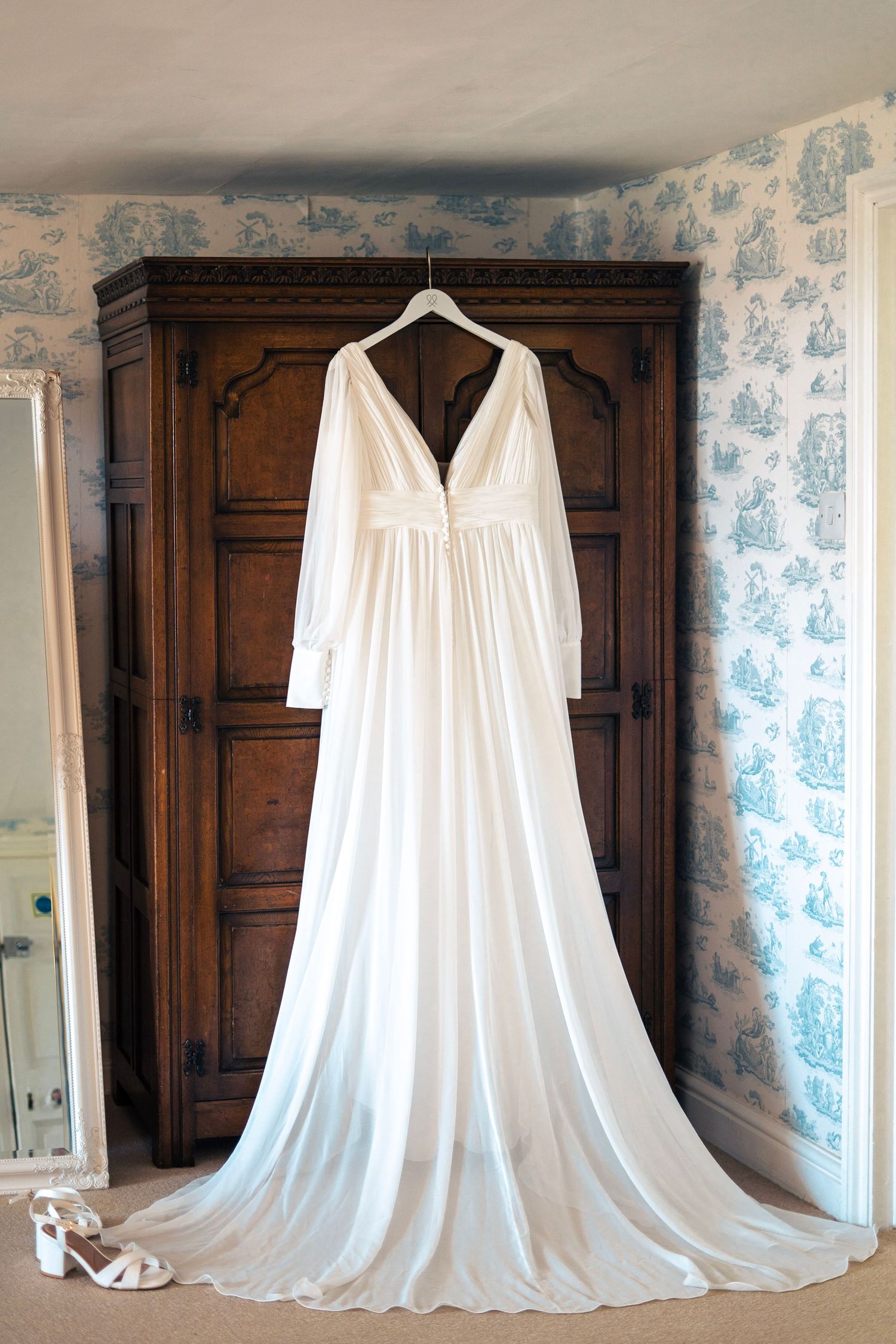 Wed2B bridal gown hanging on wardrobe at Tredudwell Manor