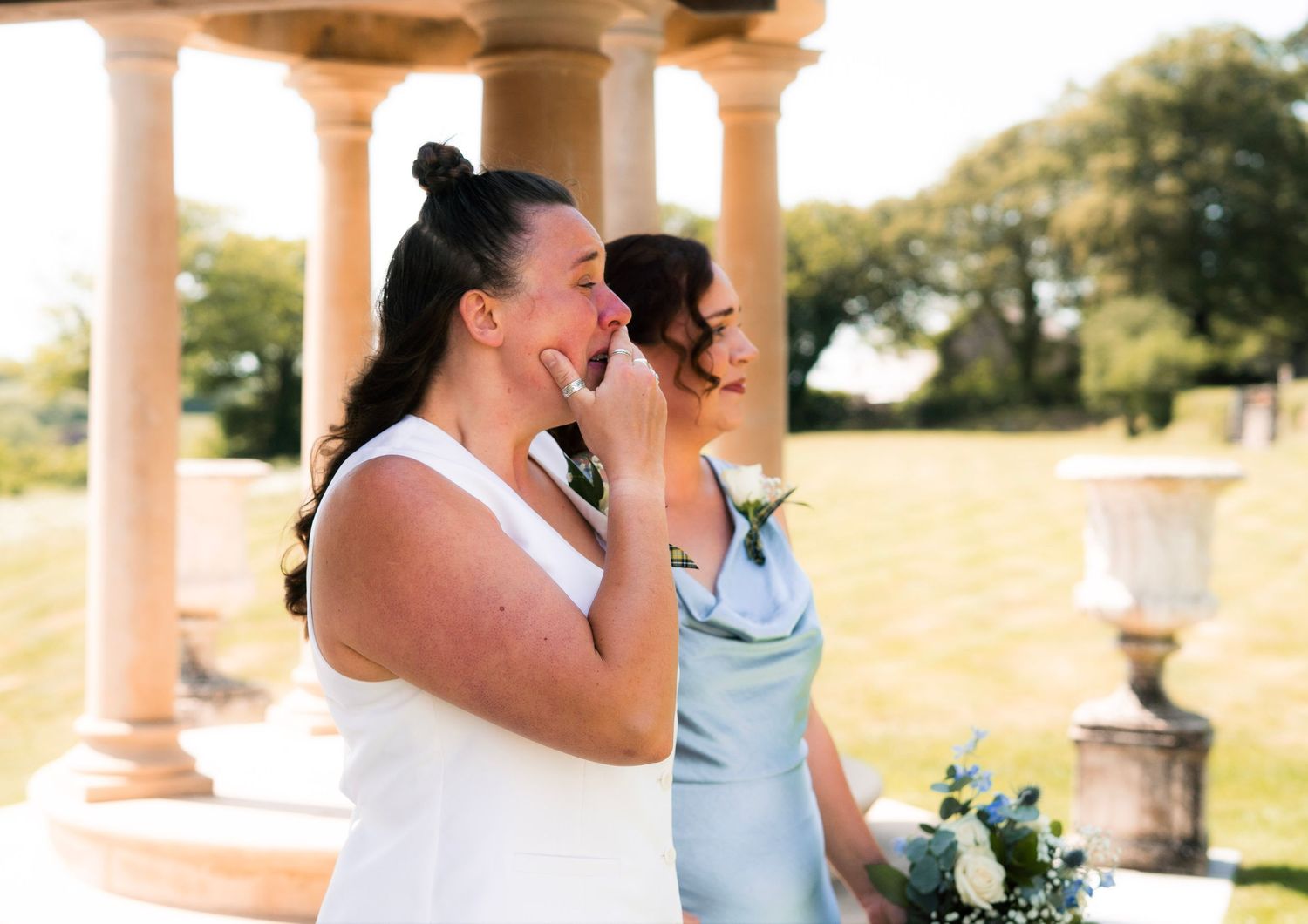 Candid photo of emotional bride during same-sex marriage at Tredudwell Manor