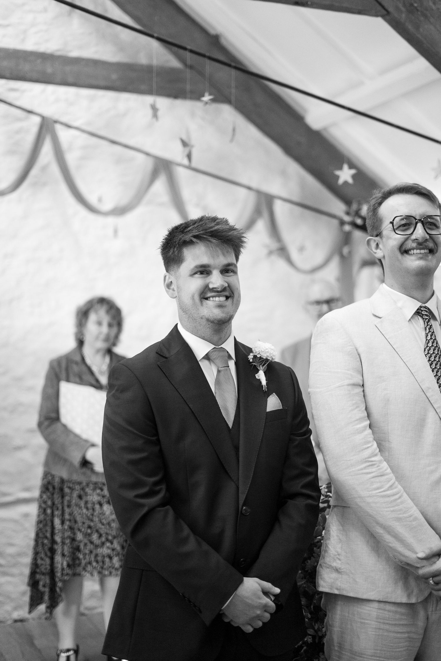 Groom waiting for bride to walk down the isle during their wedding at Trerice National Trust