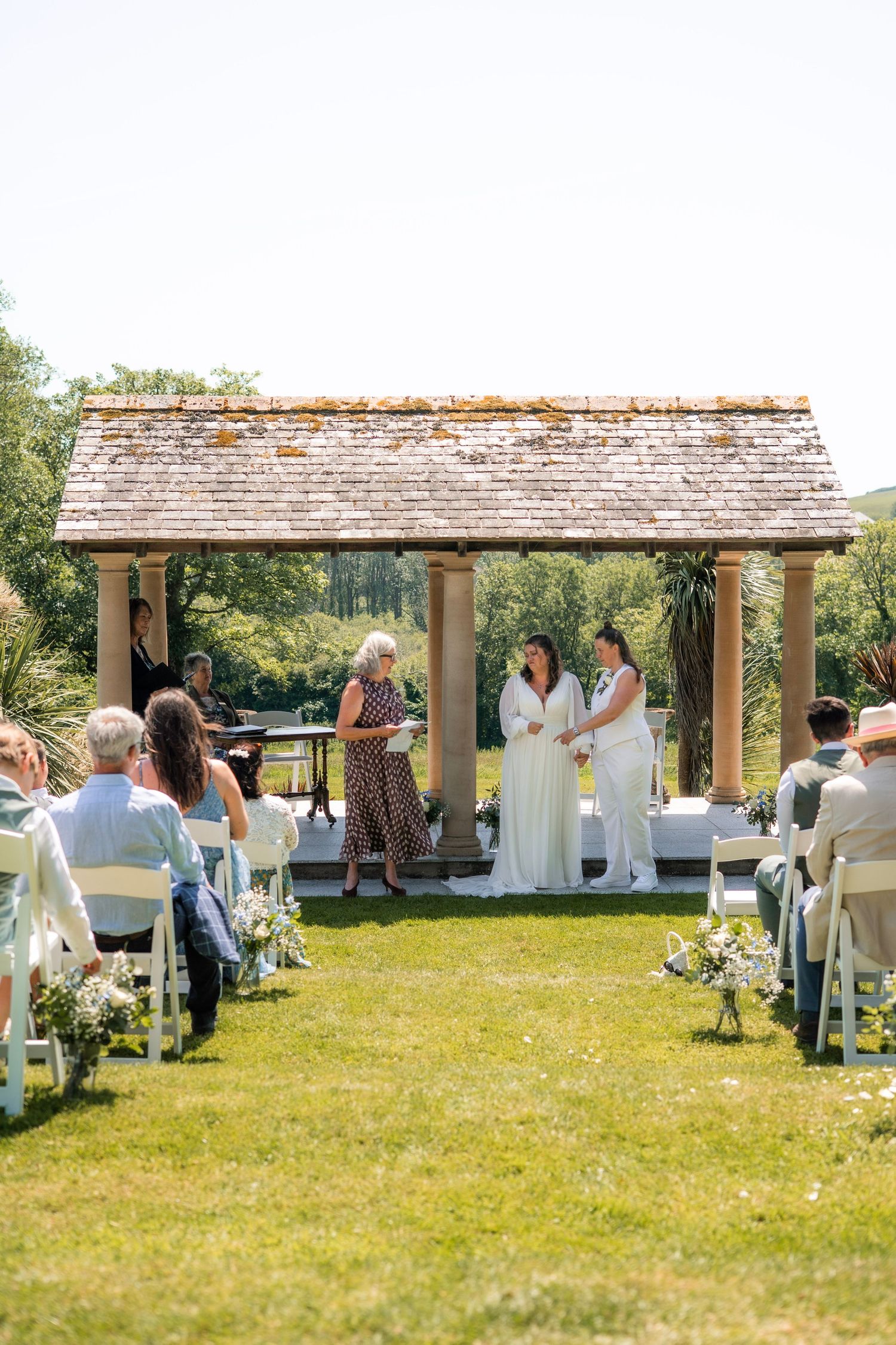 vow exchange during same-sex wedding at Tredudwell Manor, Cornwall