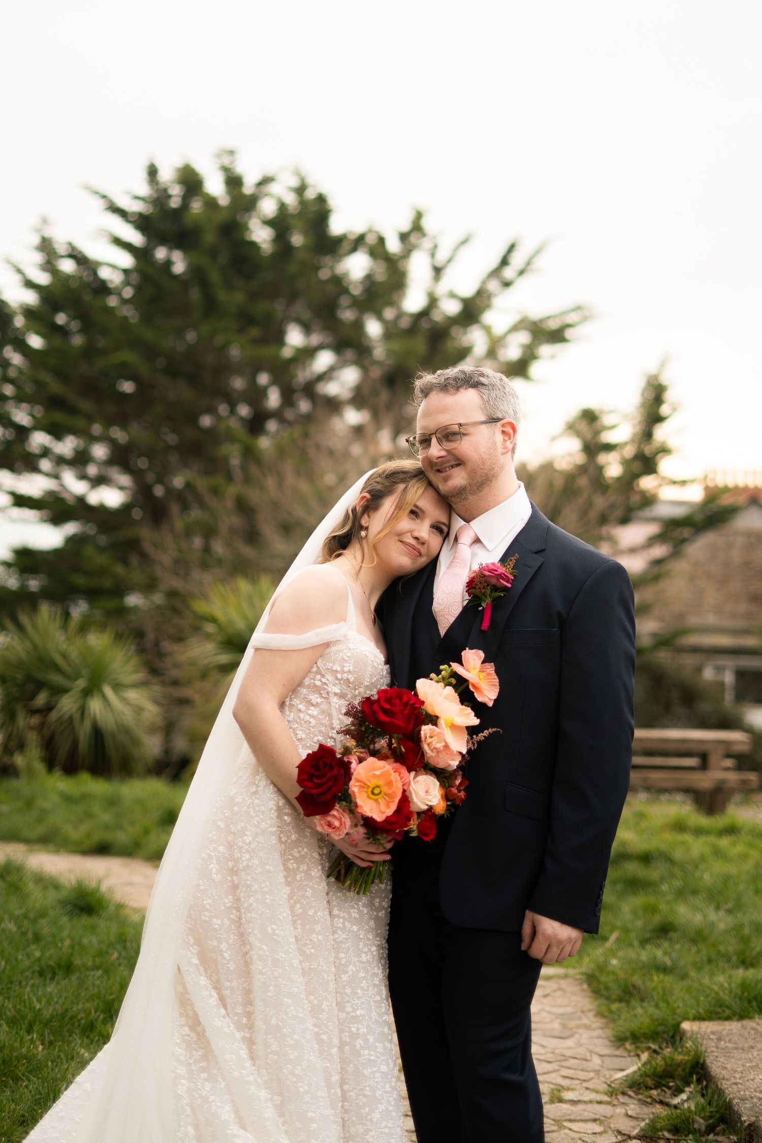 Editorial portrait of bride and groom outside Penzance Church on their wedding day