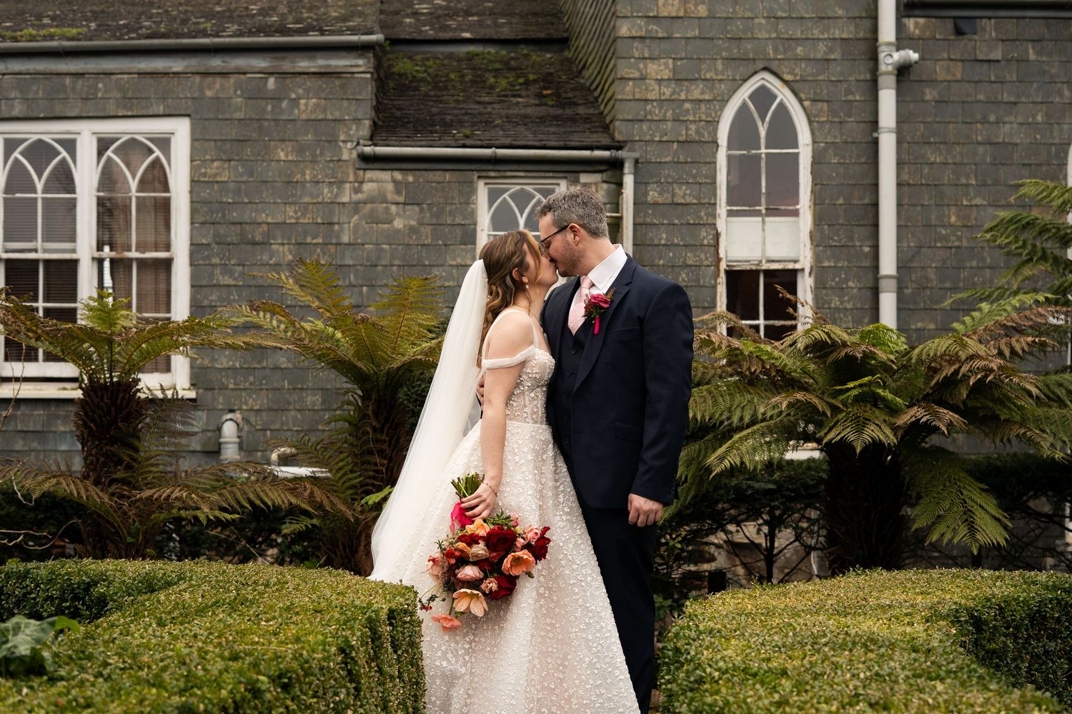 Portrait of bride and groom kissing. Penzance wedding, Cornwall