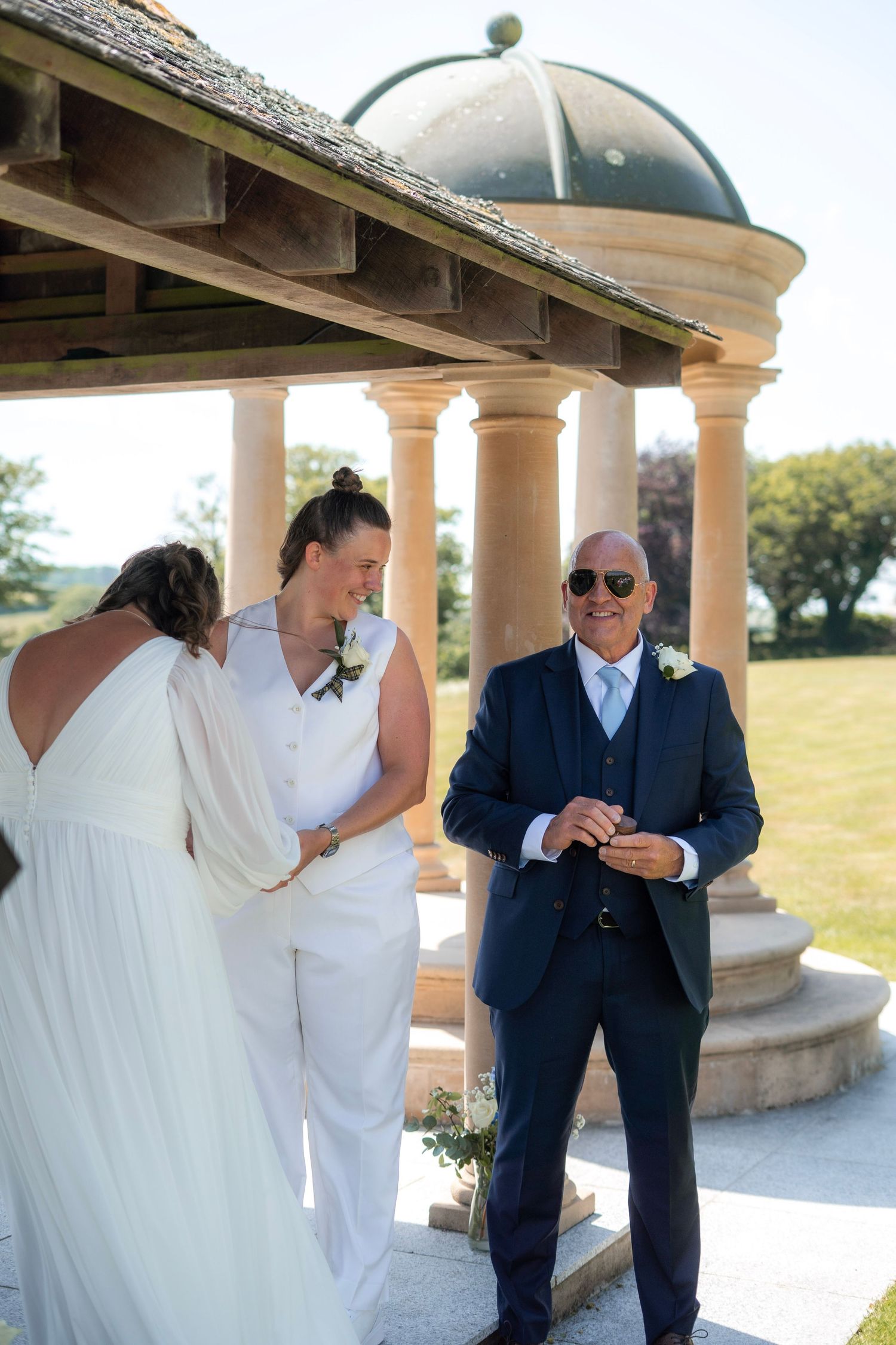 Ring exchange during outdoor ceremony at Tredudwell Manor, Cornwall